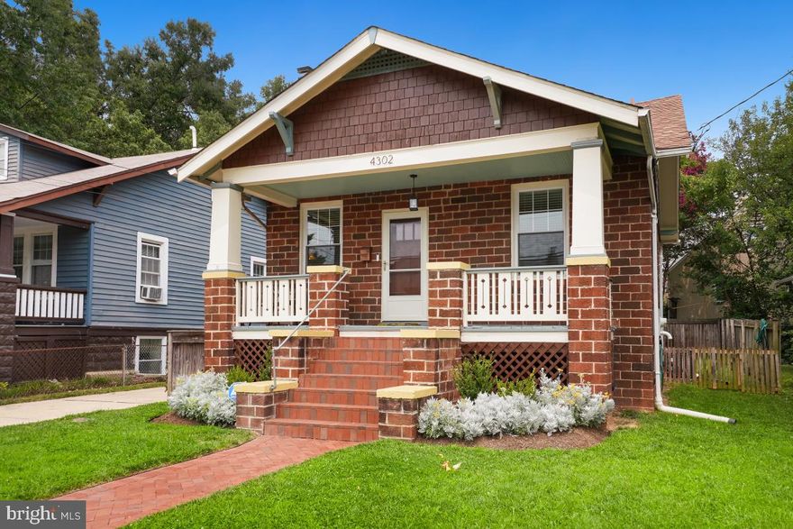 The kind of magical craftsman 1920's bungalow that steals our hearts - located in Hyattsville's historic and burgeoning arts district. Impeccably renovated, seamlessly integrating its warm period detail with modern upgrades. You will be delighted with the fresh feel and tasteful everything. Lovely original wood floors throughout. Period mantel surrounds the gas fireplace in the living room. Wall of windows bring in sunlight in the gracious dining room.  Stunning kitchen with new wood floors, stone countertops, beautiful custom cabinetry and stainless appliances - and a breakfast bar for eating, hanging out and enjoying your coffee or wine! The spirit of a sunny cottage yet spacious and so livable! Top floor is a wonderful primary suite with ensuite bath and so much charm! Large level fenced rear yard! Delightful front porch!  Walk to everything - Metro, Marc train, University Town Center, bars, coffee shops, shops and cinema. This one is so sweet - truly a HOME. Open Sunday 1-4