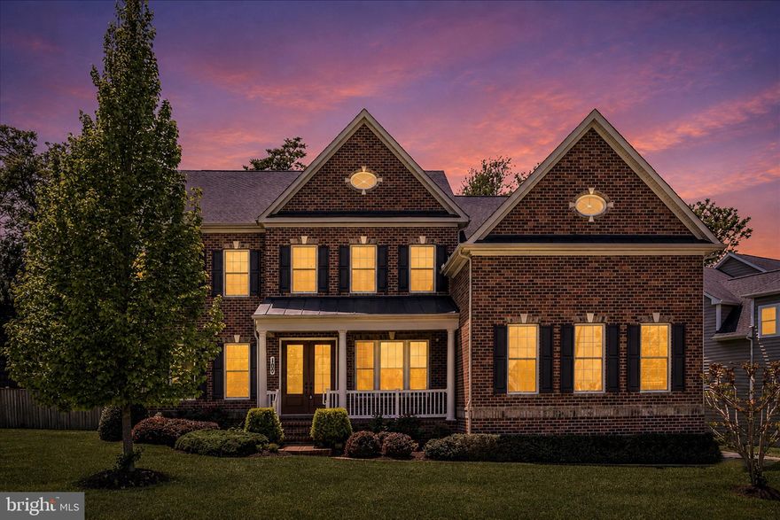 *An Exceptional Residence of Rare Scale and Refined Craftsmanship*
Commanding a premier corner lot within a serene cul-de-sac, this stately brick-front and brick-sided home is a masterclass in custom construction. Beautifully landscaped grounds and a welcoming front porch set the tone for the distinguished living experience within, while the side-load garage — finished with a professional epoxy floor — enhances a curb appeal that is truly second to none. Freshly painted throughout, the home presents in pristine, move-in-ready condition.
Step inside and the home announces itself immediately: the dramatic two-story family room commands attention with soaring double-height coffered ceilings, while rich hardwood floors and extensive custom molding and millwork flow seamlessly throughout the first and second levels. A stunning study with a built-in library, bay window, and French doors offers a private sanctuary for work or reflection, and the quality of craftsmanship evident in every room — from the custom built-ins to the intricate trim details — speaks to a standard of construction rarely found.
The kitchen is a showpiece in its own right, anchored by a massive center island and appointed with high-end appliances including a double wall oven, cooktop, and a separate beverage refrigerator. A elegant backsplash adds a refined finishing touch, while extended cabinetry provides exceptional storage. The adjacent pantry is nothing short of stunning — fully outfitted with custom cabinetry, granite counters, and a matching backsplash, it functions as a beautifully finished room unto itself. A generously sized mudroom with custom built-ins provides the perfect transition from garage to home, and just off it, a large walk-in custom coat closet delivers the kind of thoughtful organization that elevates everyday living.
Each of the six bedrooms — including a convenient main-level bedroom — enjoys access to its own bathroom, offering a level of privacy rarely matched. Every bathroom in the home is appointed with granite counters and upgraded tile, delivering a consistent level of luxury from top to bottom. Two upper-level bedrooms share a thoughtfully designed Jack-and-Jill configuration, each with its own private sink and vanity area and a shared shower and water closet. The primary suite is a true sanctuary: a generous sitting area and private porch set the stage, while dual high-end custom closets provide unmatched organization. The spa-inspired primary bathroom is equally impressive, featuring dual vanities with granite counters, upgraded tile, a grand walk-in shower with dual shower heads, and a separate soaking tub — a private retreat designed for genuine relaxation and indulgence. The upper-level laundry room, appointed with custom cabinetry, adds both everyday convenience and refined functionality exactly where it is needed most.
The fully finished lower level extends the home's living space considerably, housing a completed home gym with equipment and a wall mirror — everything needed for wellness without leaving home. Outdoors, a uniquely designed deck with a classic gazebo, patio, and private terrace off the primary suite invite effortless entertaining and quiet retreat through every season.
This is a home for those who accept nothing less than extraordinary.