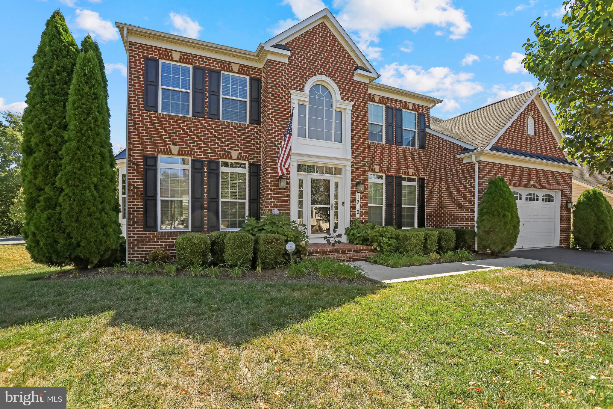 Welcome to 1310 Moore Spring Court, a beautifully maintained brick-front Colonial located in the sought-after Brunswick Crossing community. This spacious residence offers over 4,300 square feet of finished living space across three levels, thoughtfully updated with a freshly painted interior, a wide rear deck, and a screened-in porch that invites peaceful outdoor living.
Inside, the main level greets you with hardwood floors and timeless architectural touches, including crown molding, tray ceilings, and wainscoting. Formal living and dining rooms offer an elegant setting for gatherings, while a dedicated home office with French doors provides a quiet retreat for work or study. The kitchen blends form and function with stainless steel appliances, granite countertops, a large center island, and generous cabinet space. The adjoining breakfast room is brightened by vaulted ceilings and oversized windows, and the nearby family room features a cozy gas fireplace—perfect for relaxed evenings at home.
Upstairs, the spacious primary suite includes a tray ceiling, a sitting area, two walk-in closets with custom built-in shelving, and a spa-inspired bath with a jetted soaking tub, separate shower, and dual vanities. Also on this level are three additional bedrooms and a shared full hall bath offering plenty of space and comfort.
The fully finished lower level expands your living options with a large recreation room, wet bar, and a dedicated theater room—ideal for entertaining or unwinding. A full bath and flexible layout add convenience and versatility. The home also includes a full interior sprinkler system for added peace of mind.
As part of the award-winning Brunswick Crossing community, you’ll enjoy exceptional amenities including a resort-style pool, fitness center, clubhouse, dog parks, tennis courts, volleyball and soccer fields, walking trails, tot lots, and on-site shopping and dining options.
Located just minutes from the MARC train and Routes 340 and 15, with easy access to I-70, this home offers a seamless commute to Frederick, Montgomery County, and beyond. Both Dulles International and BWI Airports are within reach for added travel convenience.
Combining timeless charm, abundant space, and access to premier amenities, 1310 Moore Spring Court offers the ideal opportunity to enjoy elevated living in the heart of Brunswick Crossing.