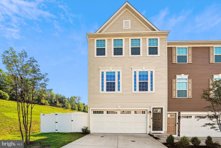 Stunning 3-bedroom, 2.5-bath end-unit townhome in the desirable Bells Hill Terrace community! The main level features elegant LVP flooring and a gourmet kitchen equipped with stainless steel appliances and sleek granite countertops, complemented by a separate dining area. Enjoy easy access from the kitchen to the brand-new Trex deck, complete with vinyl railings, overlooking a fully fenced backyard—perfect for outdoor living.
Upstairs, the primary bedroom offers a walk-in closet and a private ensuite bathroom. Two additional bedrooms share a well-appointed hall bath. The lower level boasts a large rec room, ideal for entertainment or relaxation. This home also includes a two-car garage and driveway parking for your convenience. The property is situated near I-95, and the VRE making commuting more convenient.  Just a short drive to Quantico Base and Fort Belvoir. Close to various shopping centers, including Stafford Marketplace, which offers a range of stores, restaurants, and essential services