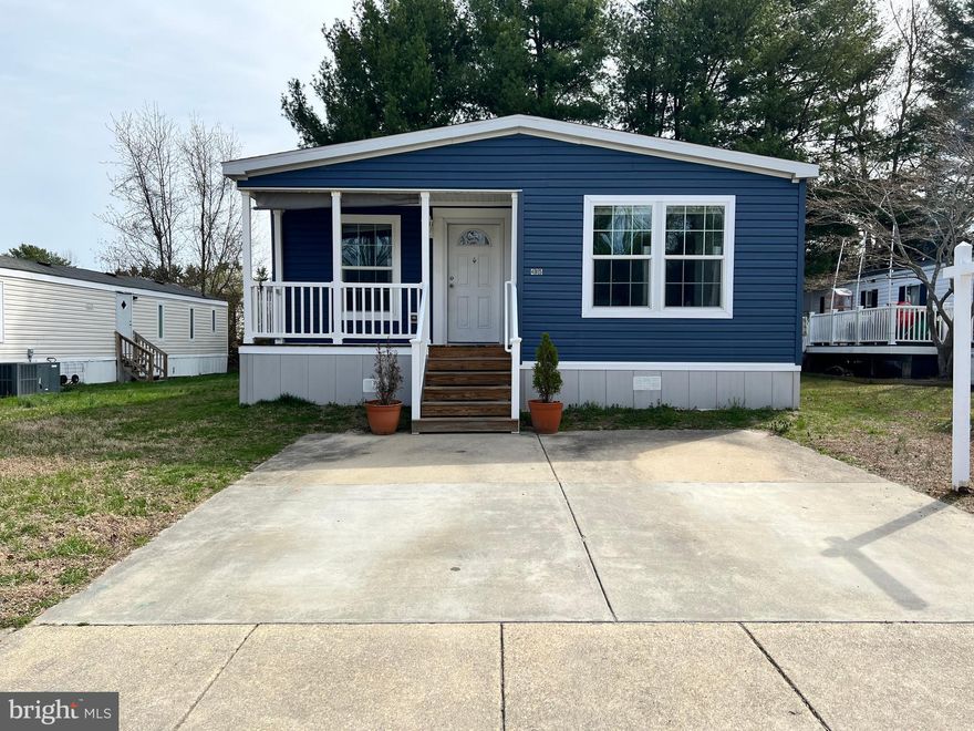 **Spacious Double-Wide | 3 Bed / 2 Bath |  1,500 Sq Ft**

Welcome home to this beautifully appointed double-wide offering nearly 1,500 square feet of thoughtfully designed living space. From the moment you arrive, you'll appreciate the covered front porch — perfect for morning coffee or evening relaxation — along with generous side yard space and a handy 10x10 storage shed.

Step inside and you'll immediately notice the quality throughout, starting with **real drywall** (not drywall panels) giving every room a solid, finished feel. The open-concept kitchen is a true showstopper, anchored by a **huge island with seating** — ideal for entertaining or casual family meals. The built-in entertainment center with sliding **barn door** adds stylish character to the living area, while the **electric fireplace** creates a cozy ambiance year-round.

The primary suite is your personal retreat, featuring a **walk-in closet** and an oversized shower. Two additional bedrooms and a second full bath offer plenty of room for family or guests.

**Recent updates take the worry out of ownership:** dishwasher replaced June 2025, roof repaired March 2026, plus all-new blinds for every window. As a bonus, **5 gallons of paint are included** — move in and make it your own from day one.

Tucked away on a **back, quiet street**, this home still keeps you close to everything the community has to offer — including **trash and water covered by HOA fees**, sidewalks, playgrounds, a pool, tennis court, and basketball court.

*This one checks every box — schedule your showing today!*
