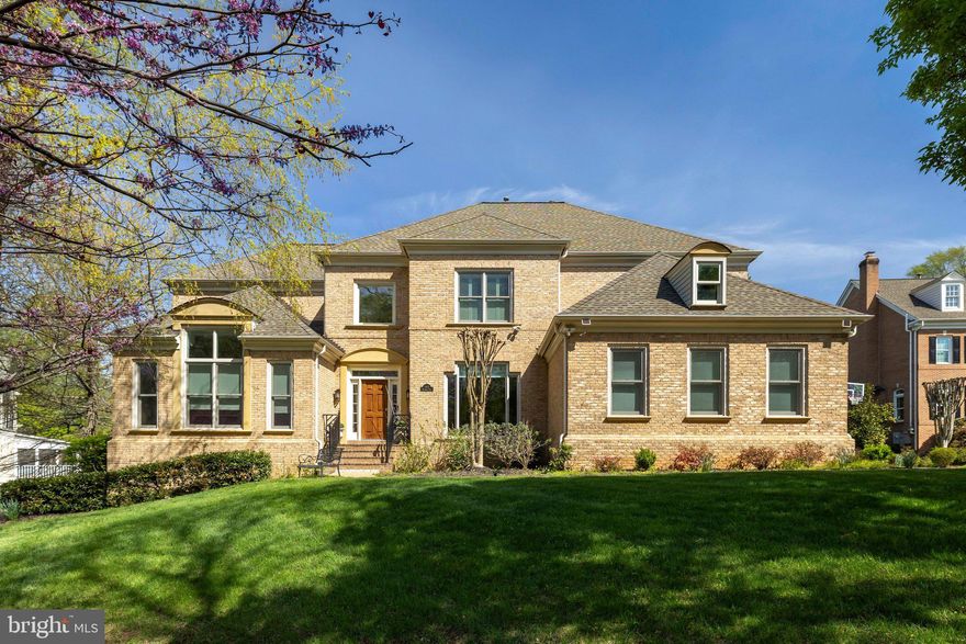 Magnificent residence on a beautifully treed, professionally landscaped lot in highly sought-after McLean 100. This exceptional home features soaring ceilings and a dramatic open floor plan with walls of windows that flood every room with natural light. Elegant architectural details include coffered and tray ceilings, gleaming hardwood floors on two levels, handsome moldings and wainscoting, and a grand foyer. The main level offers expansive living and entertaining spaces: a stunning two-story great room, large library with custom built-ins, and hearth room with built-ins and two-sided fireplace off the kitchen. The custom kitchen with grey and white cabinetry opens seamlessly to the family room—ideal for both everyday living and entertaining. This 6-bedroom, 5.5-bath home includes a desirable main-level primary suite with spa-inspired bath and steam shower. The upper level features four spacious bedrooms and three fully renovated bathrooms. The huge walk-out lower level is fully finished and sun-filled, with luxury vinyl plank flooring, an additional bedroom and full bath, and expansive flexible space perfect for a recreation room, gym, or guest suite. Exceptional outdoor living includes a large screened porch and Trex deck overlooking a flat, private backyard with fountain—an ideal setting for relaxing or entertaining.Magnificent residence on a beautifully treed, professionally landscaped lot in highly sought-after McLean 100. This exceptional home features soaring ceilings and a dramatic open floor plan with walls of windows that flood every room with natural light. Elegant architectural details include coffered and tray ceilings, gleaming hardwood floors on two levels, handsome moldings and wainscoting, and a grand foyer. The main level offers expansive living and entertaining spaces: a stunning two-story great room, large library with custom built-ins, and hearth room with built-ins and two-sided fireplace off the kitchen. The custom kitchen with grey and white cabinetry opens seamlessly to the family room—ideal for both everyday living and entertaining. This 6-bedroom, 5.5-bath home includes a desirable main-level primary suite with spa-inspired bath and steam shower. The upper level features four spacious bedrooms and three fully renovated bathrooms. The huge walk-out lower level is fully finished and sun-filled, with luxury vinyl plank flooring, an additional bedroom and full bath, and expansive flexible space perfect for a recreation room, gym, or guest suite. Exceptional outdoor living includes a large screened porch and Trex deck overlooking a flat, private backyard with fountain—an ideal setting for relaxing or entertaining.