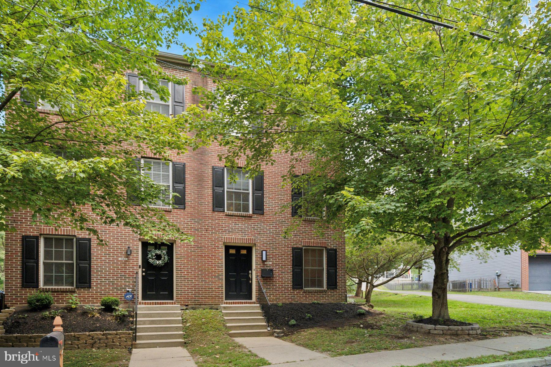 Welcome to 284 Parker Avenue, a move-in ready end-unit twin offering the perfect blend of style, comfort, and convenience. Featuring 3 bedrooms, 2 full baths, and 2 half baths, this home boasts a one-car garage plus parking for three additional vehicles—a rare find in Manayunk.
The entry level offers a versatile den or office, a half bath, laundry area, and direct access to the garage. Upstairs, the heart of the home awaits: a luxury kitchen with a thoughtful layout, large island, coffee and wine bar, stainless steel appliances, endless cabinet space, and ample countertops. From the kitchen sink, enjoy a serene view of the backyard, or step right out onto your new deck—perfect for dining, entertaining, or simply relaxing. This level also includes a dining area, spacious living room, and a fully renovated half bath. Throughout the home, you’ll find brand-new flooring and modern finishes.
The upper level features three generously sized bedrooms with excellent closet space, a hall bath, and a serene primary suite with accent wall, ensuite bath, and walk-in closet. A recently upgraded high-efficiency HVAC system ensures year-round comfort.
The expansive backyard offers wooded views and plenty of room to create your dream outdoor retreat. This home once featured a pool, which has since been removed, but the pool equipment remains on-site should the next owner wish to reinstall one. The low HOA fee covers lawn trimming, snow removal, and common area maintenance, making homeownership both easy and affordable.
All of this is just a short walk to Ivy Ridge Station, minutes from Wissahickon trails, and close to everything Main Street Manayunk has to offer.