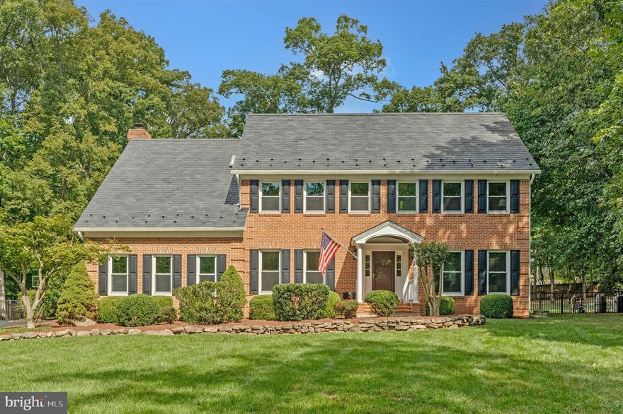 Exceptional Acreage Opportunity in Eastern Loudoun County!
Rarely does the chance arise to own acreage in Eastern Loudoun County. Welcome to 116 Lake Drive, Sterling, VA—a truly unique property situated mere steps from both the Loudoun-Fairfax county line and where Great Falls meets Sterling. This beautifully remodeled, custom-built home spans 5,300 square feet and features four bedrooms and four-and-a-half bathrooms, all nestled on a tranquil 1.34-acre wooded lot.
Arrive via a winding driveway that crosses a trickling brook, leading you to your own private sanctuary. Though you're just moments from the shopping, convenience, and vibrant activity of Sterling, Great Falls, Herndon, and Reston, this secluded oasis offers the relief of quiet retreat. Effortless access to Route 7 and Algonkian Parkway (which becomes Fairfax County Parkway) puts Tysons Corner and Leesburg within easy reach, and the Dulles International Airport is simply minutes away.
Inside, the main level features gleaming hardwood floors, a dedicated office with built-in bookcases, a gourmet kitchen with granite countertops, GE appliances, a spacious walk-in pantry, custom Kraftmaid cabinetry, and a sunlit breakfast area. The family room centers around a wood-burning fireplace, and the main level is completed by a designer half bath. Hardwood flooring extends upstairs to the upper foyer and into the primary suite, which impresses with vaulted ceilings, skylights, another wood-burning fireplace, and a massive walk-in closet. The luxurious primary bathroom showcases travertine stone tile, a Maax jetted tub, and a custom shower. Three additional bedrooms offer abundant space—one with an en-suite bath, while the other two share a convenient "Jack and Jill" bath layout. The laundry room, equipped with shelving and cabinet, is thoughtfully placed on the upper level.  The fully finished lower level provides ample space for relaxation and entertainment. Here you'll find a full bathroom, multiple areas for TV viewing, a regulation size pool table (which conveys), and an expansive storage / craft room with built-in shelving.
Step outside to a lush green front yard adorned with mature landscaping and a stone walkway that leads to a custom cedar-barreled portico front porch. The backyard is a true oasis: a magnificent 20x40 inground gunite pool with diving board (from 3 to 11 feet deep) and elevated eight-person spa with waterfall set on flagstone and concrete patio, an asphalt basketball court with Goalrilla brand hoop, 2 storage sheds, and a level lawn perfect for games. A 1,000-gallon underground propane tank heats the pool and spa and provides a dedicated line for your outdoor grill.  Meticulously cared for and freshly painted throughout, the home features a brick façade, Hardie Plank cement board siding on three sides, a durable slate roof, dual-zone HVAC, Simonton premium windows, and a side-load garage.
You’ve got to see it to believe it.  Come discover your peaceful haven from the bustle of Northern Virginia - conveniently situated in Eastern Loudoun County!