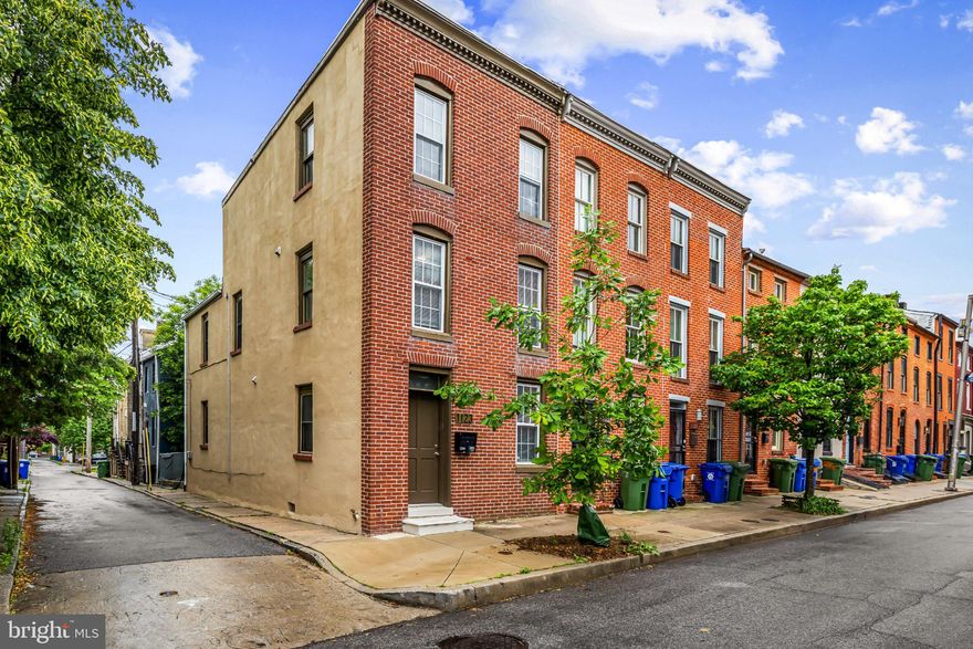 Welcome to 1123 Hollins Street—a beautifully renovated (2018) 3-bedroom, 2.5-bath end-of-group rowhome ideally situated beside historic Hollins Market, the oldest existing public market building in Baltimore and a centerpiece of one of the city’s most exciting revitalization corridors.

Spanning three finished levels, this thoughtfully designed home offers a layout that works equally well for comfortable owner-occupancy or long-term investment. Features include a private third-floor primary suite, second-floor laundry, and abundant natural light from rare front, side, and rear windows—an exceptional feature in city rowhome living. The unfinished basement provides valuable storage space.

A standout financial advantage is the remaining CHAP historic tax credit, offering significant ongoing property tax savings for the next owner.

Enjoy immediate access to neighborhood favorites including Rooted Rotisserie, Zella’s Pizzeria, and Oh Honey On The Bay, while benefiting from the continued momentum of major neighborhood investment and redevelopment nearby. Whether you're searching for a place to call home or a smart addition to your portfolio, 1123 Hollins Street offers historic character, modern convenience, and compelling long-term value.