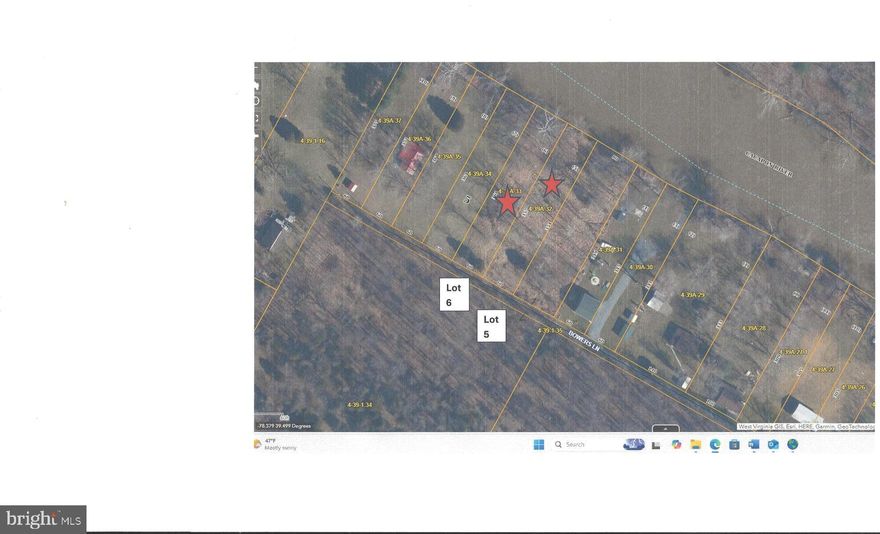 Quiet area, lot fronts on the Cacapon River.  Level lot, mostly cleared (brush needs cleared). Road runs across the back end of the lot so no obstruction into the river.  Lot size is just under 1/2 acre, 60' frontage on the river.. Lot is over 350' deep x 60' wide.  Electric runs along the road.  The lot is within the flood plain.  Plan more for recreation as building within the flood zone has become somewhat restrictive.  Install your firepit, camp along the river. The Cacapon is known as one of the cleanest rivers in the state.