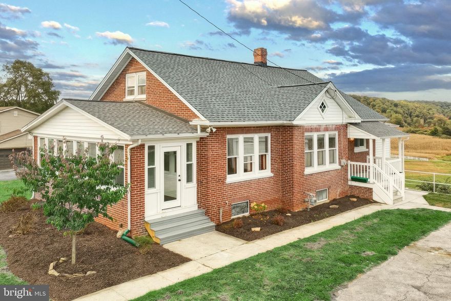 Welcome to 203 York Rd — a beautifully redone all-brick Cape Cod offering over 2,000 sq. ft. of finished living space. This 3-bedroom, 1.5-bath home blends modern style with charming original character. Step inside to find a brand-new kitchen featuring high-end cabinetry, striking quartz countertops, stainless steel appliances, and a stylish backsplash. Exposed brick accents flow into the dining area, while large windows fill the home with natural light. The main level offers a spacious living room, first-floor bedroom, and a bright enclosed front porch surrounded by new windows. Off the kitchen, a remodeled cabinetry area leads to a massive PVC deck with sweeping pasture views — perfect for relaxing or entertaining. The detached 2-car garage includes new doors and below-ground storage. With a walkout basement, over three-quarters of an acre, and an excellent location near highways, parks, and shopping, this move-in ready home is a rare find.