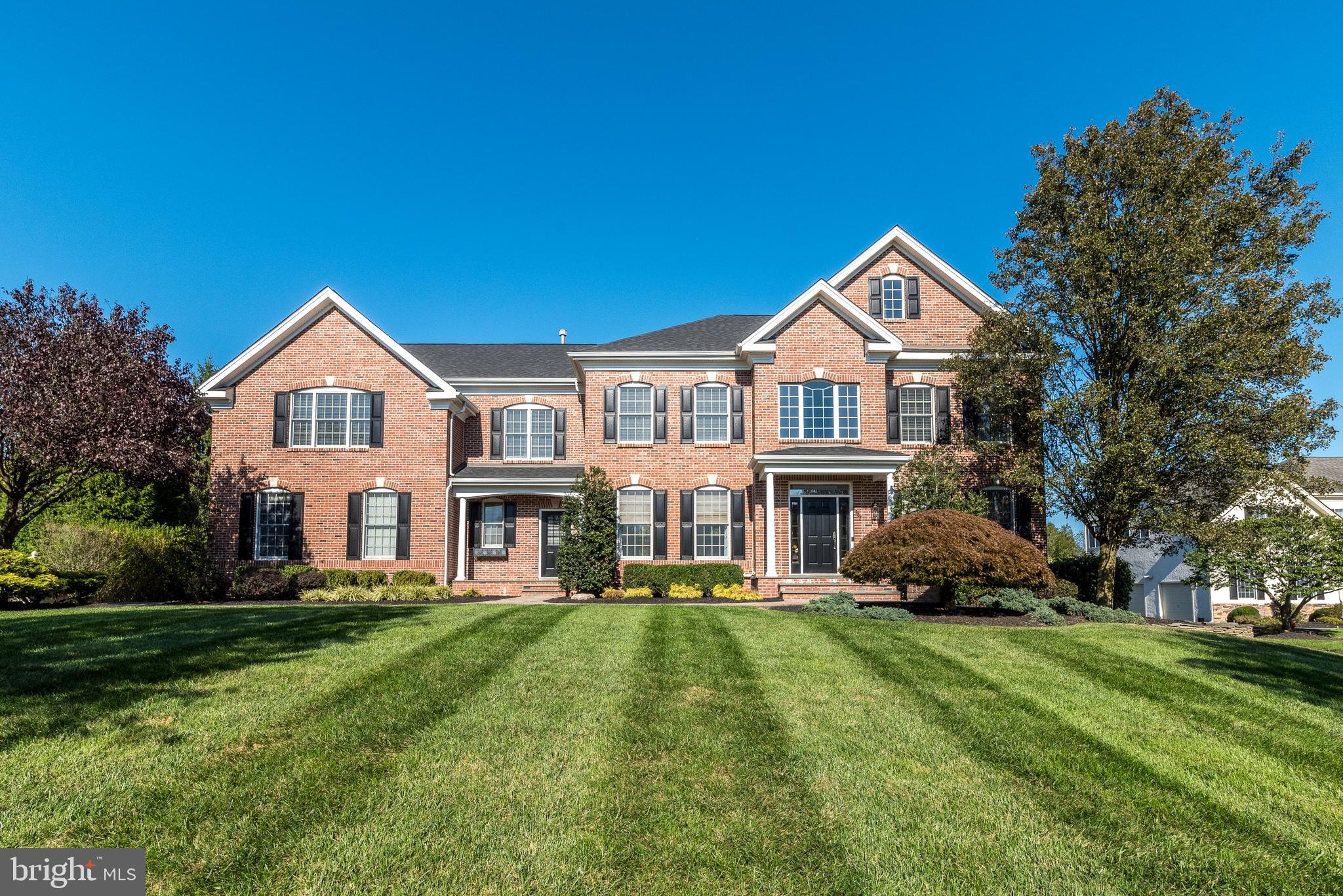 Experience the epitome of luxury living in this stunning 5 Bedroom, 6 Bath brick Colonial with over half a million dollars in magical recent upgrades (2022-23), making it better than new construction, within Horsham’s highly desirable neighborhood of Highgate. Situated on a gorgeous 1-acre lot within a cul-de-sac, this home offers 3 levels of masterful amenities including the walk-out Lower Level, with not a single detail having been overlooked. 9’ Ceilings on the 1st and 2nd floors, freshly painted inside and out, new custom millwork, a brand-new roof (2023), new lighting fixtures and new window treatments thru-out, are just a few of the details to give you a hint of what is to come. The dramatic 2-story entrance foyer provides a view of the open floor plan and features a curved staircase w/rounded wall. Whether you are a gourmet chef or an expert at ordering take out, you will not want to leave the incredibly renovated Gourmet Kitchen with hardwood flooring, new quartz counters on the island and perimeter, new tiled backsplash, new oversized sink with instant hot/cold, refinished 42” cabinets with added soft-close, stainless double wall ovens, Miele dishwasher and included new refrig. The newly created, custom walk-in Pantry Closet with new French Doors features clever pull-outs, tiled backsplash and new luxury vinyl floor. The Kitchen is open to the Breakfast Room with a wall of windows overlooking the rear grounds and a sliding French door to the rear Deck. The Kitchen is also open to the fabulous 2-story Family Room with brick, gas fireplace, speakers, new exposed beams, rounded wall and 2nd floor Balcony. The gorgeous renovated Powder Room includes 12” marble tile flooring & a new vanity w/quartz counter. Enjoy working from home in the 1st floor Office with newly added professionally organized closet, new built-in cabinet, new crown molding and French doors. The fantastic, newly created Mud Room offers a new Dutch Door (perfect for pets w/scratch free interior side), new luxury vinyl floor and new utility sink with quartz counter. 2 sets of stairs provide access to the 2nd floor. The Primary Bedroom and adjacent Sitting Room open up to another spectacularly renovated space. New French doors lead to the Dressing Area with 2 new custom closets with special sections for everything from shoes to hanging clothes. The luxurious, newly renovated Primary Bath is a sanctuary of relaxation, with new tiled floor, new double vanities with quartz counters & rectangular porcelain sinks, new custom medicine cabinets w/lighting & frost controls, new Spa shower w/glass wall, new tiled floor & body sprays. There are 4 additional spacious bedrooms including one with en-suite Full Bath, plus a Full Hall Bath. The newly created Laundry Closet on this floor includes the new washer and dryer and new shelving. The experience continues in the Finished Walkout Lower Level with over 1800 sq ft of additional space, offering endless possibilities for recreation and entertainment, starting with the custom bar with granite counter and seating for 6 with mini kitchen, open to the Recreation Room with gas fireplace. The enormous Gym is a completely renovated new space w/room for every conceivable piece of equipment, w/new gym floor, new French doors & included new TV. The Theater Room offers new French doors, a raised platform for seating and new wall sconces. A Full plus 2nd Half Bath offer the opportunity for an in-law suite on this level. Outside is a lush oasis with manicured landscaping and plenty of space to enjoy the gorgeous yard, whether you are relaxing on the tiered, lower level paver patio w/fire pit, Hot Tub & built-in barbecue or hosting a barbecue with the included Weber grill on the 1st floor maintenance free Deck. A Ring security system & NEST thermostats are also included. Close to multiple parks, great shopping & major routes. The unparalleled upgrades & spacious rooms cater to every desire, creating a true dream home!