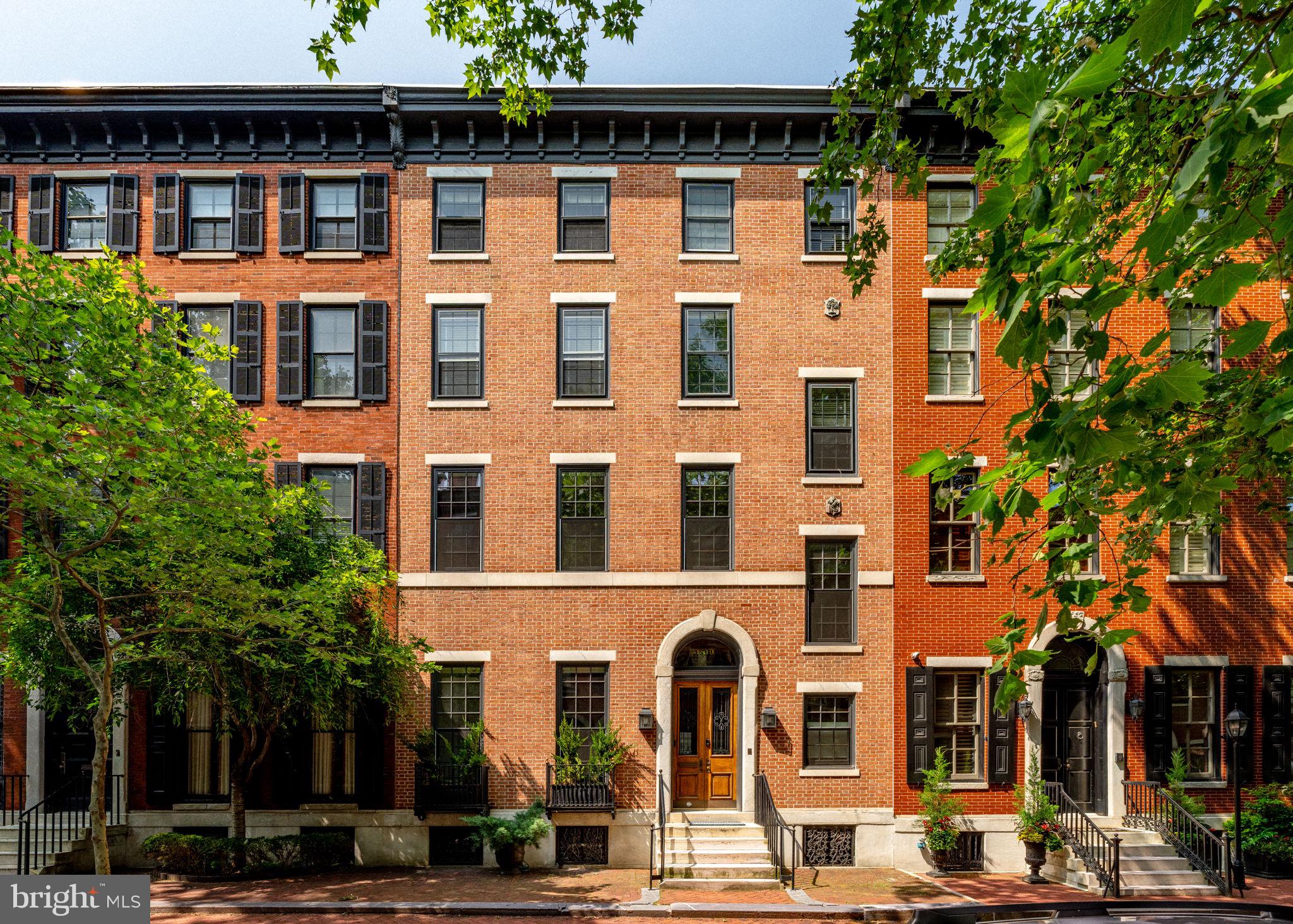 A Rare Double-Wide Gem on Iconic Delancey Place
Welcome to 1819 Delancey Place—one of only four double-wide homes on this highly coveted, Rittenhouse Square block. Spanning an impressive 29 feet in width—compared to the street standard of 20 feet—this grand, historically significant estate residence offers over 6,000 square feet of luxurious living space and exemplifies the grandeur of classic pre-war design while offering contemporary comforts.
Behind its stately brick façade lies a home of exceptional scale and comfort. The expansive layout includes five floors serviced by a 5-stop elevator and a true side-by-side TWO-car garage—a rare and highly sought-after convenience in this location.
The main level invites you into a gracious foyer, setting the tone for the home’s classic design and scale. The formal living and dining rooms feature soaring ceilings, intricate crown molding, and three marble fireplaces, complemented by Lutron recessed lighting and a built-in sound system—perfect for hosting in style.
At the heart of the home is the chef’s kitchen, anchored by a large soapstone island and flooded with natural light thanks to two dramatic skylights. Outfitted with a 48 inch Wolf range, 60" Sub-Zero refrigerator, dual sinks, and custom cabinetry, the kitchen flows directly to a private rear patio with a built-in gas grill—ideal for outdoor entertaining and alfresco dining.
The second floor has been completely reimagined into a thoughtfully designed living level. It features a stunning family room (approx 21 feet wide) overlooking Delancey Place, adorned with tigerwood paneling, a gas fireplace and enjoys southern exposure. The adjacent primary suite is a peaceful and newly done retreat, boasting an elegant en-suite bath with dual vanities, frosted glass rainfall shower, and water closet. A standout feature is the 200-square-foot custom walk-in closet—fully outfitted in walnut millwork and cleverly integrated with its own laundry area and direct elevator access for ultimate convenience.
Upstairs, you'll find four additional bedrooms and three full bathrooms—two of which have been completely gut renovated with designer finishes. There's also a dedicated home office, a cedar closet, and a large storage room. There are stairs that do go up to the roof making a roof top project easier!
The lower level offers an additional 1,000 square feet of living space. Thanks to a central atrium, this level feels bright and open, unlike any typical city basement — making it ideal for a media room, home fitness center, or casual lounge. It also includes a wet bar with a wine cooler, a whimsical “Mummers” powder room, a full laundry room, extra storage, and direct access to the garage.
Other highlights include a Crestron smart home system, upgraded multi-zone HVAC, new historic-certified windows, programmable Lutron lighting throughout, and a recently installed roof.
Perfectly positioned just steps from Rittenhouse Square and the city’s premier dining, shopping, and cultural offerings, 1819 Delancey Place is an unparalleled legacy property on the most prestigious tree-lined Philadelphia block.