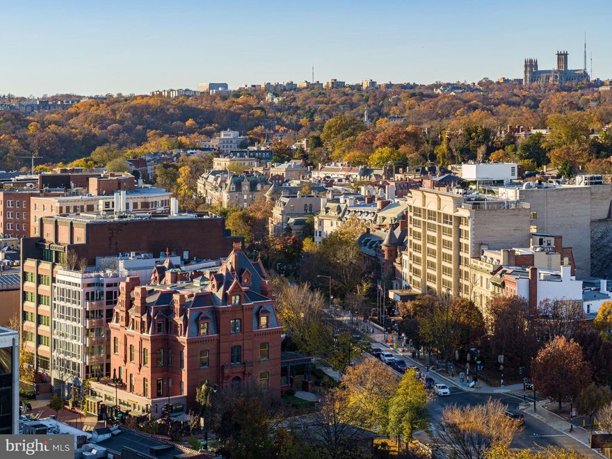The James G. Blaine Mansion stands today as one of the most extraordinary offerings in all of Washington. A rare convergence of historical grandeur, residential elegance, and commercial versatility, it occupies a commanding position at the gateway to Embassy Row. This last-of-its-kind Gilded Age mansion comprises a 7,000-square-foot private residence atop more than 8,000 square feet of income-generating commercial office space — all within a storied structure steeped in provenance.
 
Showcasing a seamless blend of timeless charm and modern functionality, the Mansion was meticulously renovated from 2006 to 2009. Two floors are configured for commercial or office use, two are dedicated to luxurious residential living, and the private rooftop spans the entire fifth level. Beneath it all lies a masterfully integrated, three-story underground garage accommodating 12 parking spaces — a rare amenity in this iconic location.
 
Approaching via the grand porte-cochère over the original cobblestone drive offers a glimpse into the world of James G. Blaine and Washington’s high society of the 19th century. Ascending the stairs and entering through the double doors, one steps directly into history.
 
The first and second floors currently serve as commercial office space, featuring more than 15 private offices, two full commercial kitchens, multiple conference rooms, and two private terraces — offering an unmatched level of flexibility.

The residence, occupying the third and fourth floors, is accessed via a private elevator that opens into a double-height reception area. A paneled archway frames a dramatic rotunda, bathed in natural light from the overhead skylight. One of six fireplaces anchors the space, complemented by exquisite millwork — each detail a testament to the vision of noted Washington architect Benjamin A. Van Dusen.
 
Throughout the home, scale and proportion are masterfully executed. A richly appointed library with extensive built-ins, two sunlit dens overlooking Dupont Circle, and embassy-sized formal living and dining rooms create an environment that is both grand and intimate. The chef’s kitchen is warm and functional, centered by a wood-burning fireplace and built-in breakfast nook. Premium appliances from Miele, Sub-Zero, and Wolf are integrated into custom wood cabinetry, set against elegant marble countertops. Whether hosting a 40-person seated dinner or a reception for 150, the residence is designed to accommodate.
 
A secluded private terrace extends from the main level — partially covered for year-round use and featuring an integrated grilling station and tranquil water feature. A temperature-controlled wine cellar adds yet another layer of luxury.

The upper residential floor, framed by the original mansard roof, serves as a private sanctuary. The primary suite features vaulted ceilings, dual dressing rooms, and two spa-inspired bathrooms. Additional bedrooms with en-suite baths are complemented by a sunlit office and a fitness room complete with sauna.
 
Above it all, the rooftop level features a private 46-foot lap pool and outdoor kitchen, with sweeping panoramic views over Dupont Circle — a true urban oasis.
 
Yet beneath the refinement lies a core of advanced infrastructure: seven HVAC zones, a comprehensive  security system, Sonos sound throughout, and double-pane windows — with triple-pane in the primary suite.
 
The historic Blaine Mansion is more than a home — it is a living monument to Washington’s past and a canvas for its future. Offering unmatched elegance, modern utility, and historical significance, this is a truly once-in-a-lifetime opportunity.