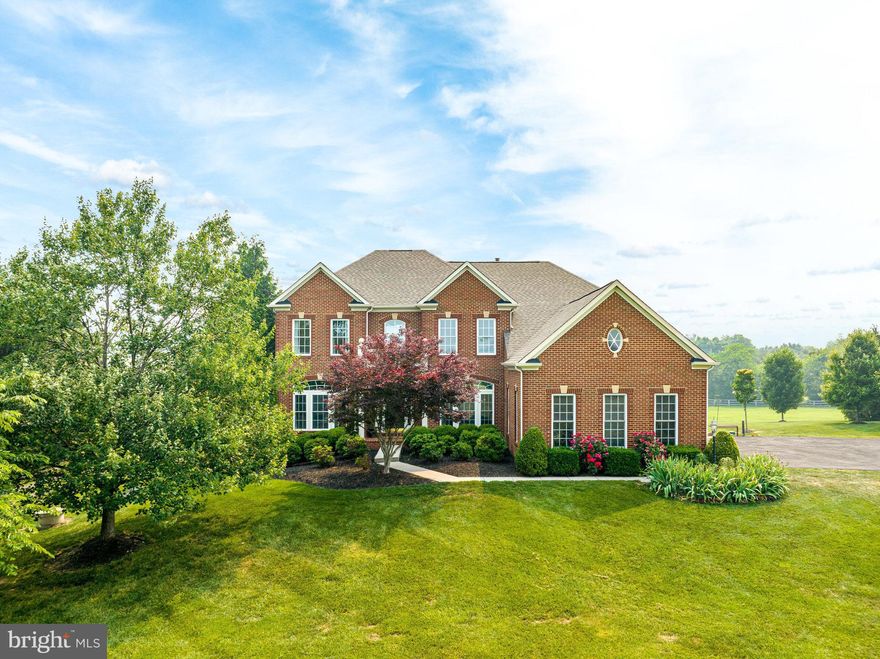 This is an exceptional property that offers a peaceful and picturesque setting in Gainesville, VA, with ample privacy on a two-plus acre lot. The spacious living space of approximately 5700 square feet is filled with natural light and upgraded flooring, creating a welcoming atmosphere.
The main level of the house features an office, a two-story family room with a beautiful stone fireplace, and a gourmet kitchen. The kitchen is equipped with a central island, breakfast bar, gas cook-top, double ovens, walk-in pantry, and a bright breakfast room.  It's an ideal space for both everyday living and entertaining. On the upper level, there are four bedrooms and three full bathrooms, providing comfortable accommodation for the entire family. The fully finished basement offers an open floor plan, a fifth bedroom, and another full bathroom. It also connects to a lovely stamped concrete patio, which leads to the parking area.
One of the highlights of the property is the large deck that spans the rear of the house, providing a perfect spot to enjoy the evening sunset. Additionally, the backyard gently slopes towards a neighboring pond, creating a serene and relaxing environment. The elevated position of the home on the lot offers fantastic views, and there is even the possibility of building a pool with an outdoor cabana in the future. The driveway of the property features a beautiful curve and is lined with mature trees, creating an inviting entrance. It leads to a spacious 3-car garage and a large parking area, providing ample space for vehicles and guests. In terms of updates and upgrades, the property boasts several recent improvements. * 2023 - New Carpet and Refinished Wood floors on the main level *  2022  - new roof, driveway, HVAC system, and hidden dog fence with collars were all installed, ensuring both comfort and convenience * Overall, this gorgeous home in Prince William County offers a blend of luxurious living spaces, privacy, and beautiful natural surroundings. It's an exceptional opportunity for someone looking for a serene and spacious property in a rural subdivision.
