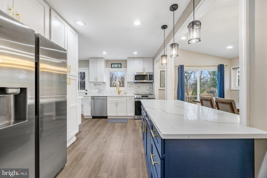 Located on a quiet street just off Falls Road, this fully renovated 4-bedroom, 4-bath home offers modern living across four finished levels. The 2023 renovation features an open-concept kitchen with expansive quartz counters, perfect for cooking and entertaining. The bright living area includes a floor-to-ceiling marble-tiled fireplace.

The primary suite boasts its own balcony, while the lower levels open to a patio, with additional outdoor seating areas by a fire pit, with pergola. With a deck, driveway, and one-car garage, this home provides comfort and convenience both inside and out. Just an 8 minute drive to Mt Washington Tavern according to Apple Maps. There is no time to waste, schedule an appt today!