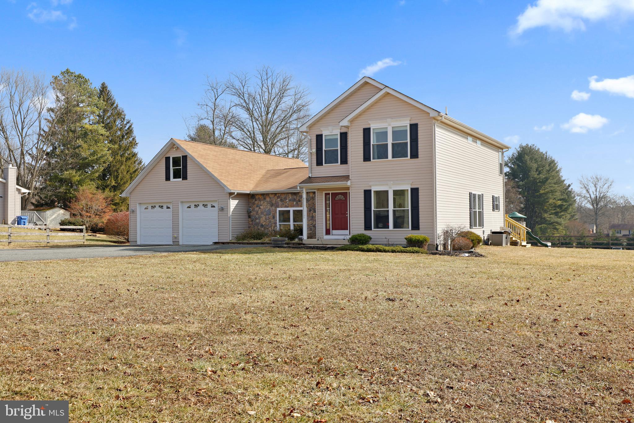Stunning colonial in Fallston! Entire home has been expanded and improved! Main level features covered porch, entry foyer, open and spacious living/dining room with carpet, crown and chair rail moldings. Gourmet kitchen with ceramic floors, granite counters, marble backsplash, stainless appliances and breakfast bar/island. Sliding doors off breakfast area to brand new rear deck. Just off the kitchen is a laundry room and updated half bath. Also has main level professional office with sliding barn door and Brazilian cherry hardwood floors. Office leads right into the first floor Primary Bedroom Suite with an oversized bedroom area and spacious walk-in closet with organizers. Fully renovated owner's bath to include custom ceramic and marble tile, crown molding, double headed shower, frameless shower glass, double vanity with marble top and custom lighting. Also features a very large main level step-down family room with built-ins, crown molding and Brazilian cherry hardwood floors. Hallway leads to a mudroom with storage cubbies and entrance into the oversized two-car attached garage. In the lower level, there is a comfortable family room, a craft/hobby room, and separate room for home gym or additional office. Plenty of storage space and a rough-in for full bath. On the second floor, there is the original primary bedroom suite with walk-in closet and full bath. Two additional bedrooms and full bath on upper level. Most rooms have crown molding, fresh paint and updated flooring. Many special features like vinyl replacement windows. 11 ceiling fans and all appliances are included, surround sound, three-zone HVAC system, alarm system with three keypads. Gas heat and hot water (by BGE, not a propane tank). Almost 4,000 square feet of finished living space in a country setting, yet only minutes away from shopping and dining options. Fallston School district. Will not last long!!