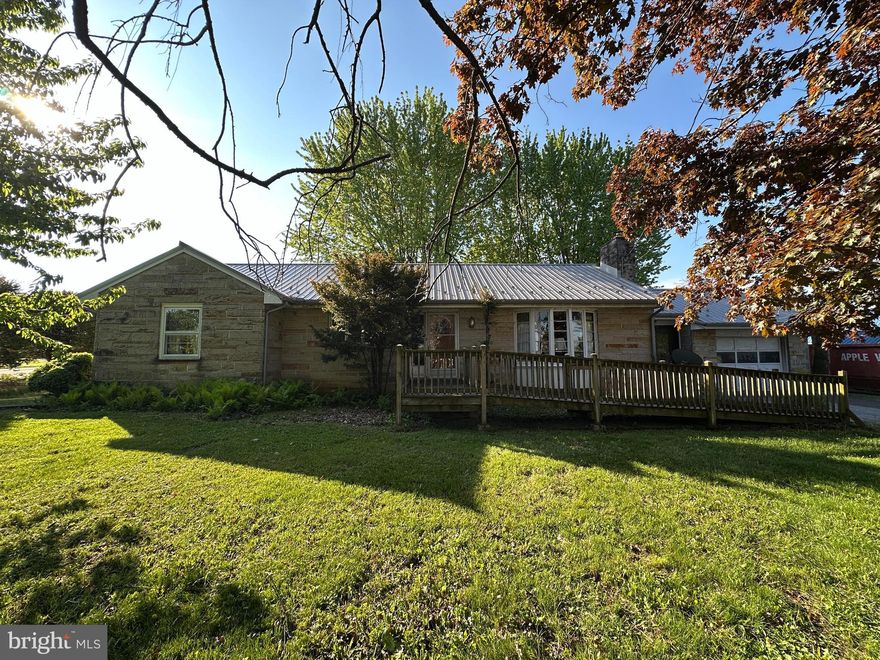GREAT INVESTMENT OPPORTUNITY – STONE RANCHER IN SHIPPENSBURG! This home offers tremendous potential. Featuring 3 bedrooms and 1.5 bathrooms, the layout includes a spacious living room with a wood stove, eat-in kitchen, dining room, foyer, breezeway, and a full basement. A one-car garage adds convenience, while hardwood floors run throughout much of the home. The durable tin roof is another bonus. Outside, enjoy a level rear yard—perfect for entertaining, gatherings, or outdoor activities. Ideally located less than 2 miles from Shippensburg Area Schools and just minutes to shopping, dining, and everyday amenities. Bring your vision and make this property shine! In need of TLC. This property will be offered at auction on Wednesday, May 20, 2026, at 3:00PM. The List price in no way represents a minimum, starting, or acceptable bid.