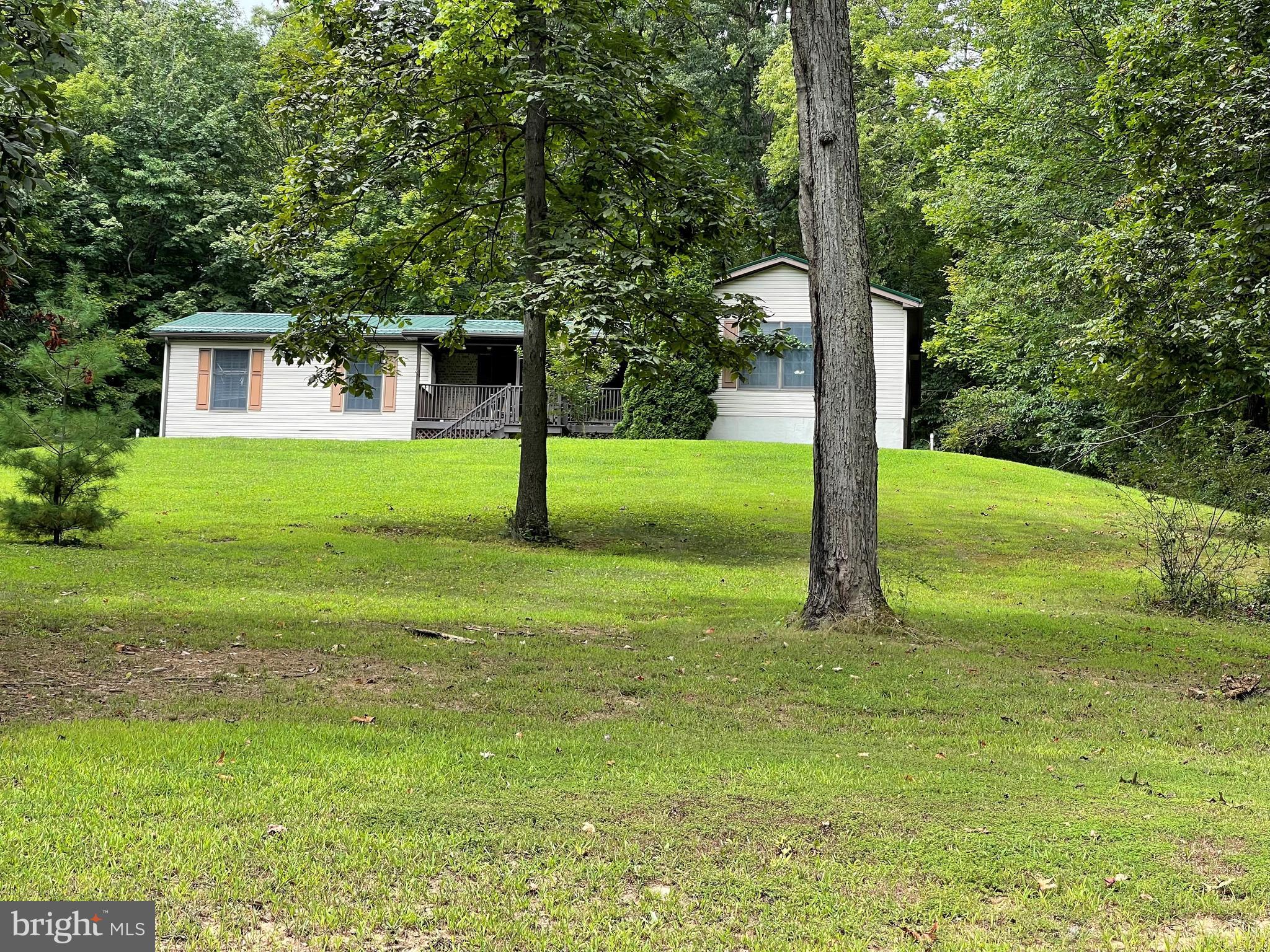 Rural 1 Acre property - no thru traffic- 3-4 Bedroom. (One has laundry hook up), Formal Dining room, Large Living room, all grace this ranch home. Plus Full basement, 2 Car integrated Garage plus 1 extra interior bay for storage/utility room. Heat pump with auxiliary Pellet Furnace. Exterior deck on front entry 1/2 mile to William Penn Highway or Rt 322, freshly painted interior and move in ready.
