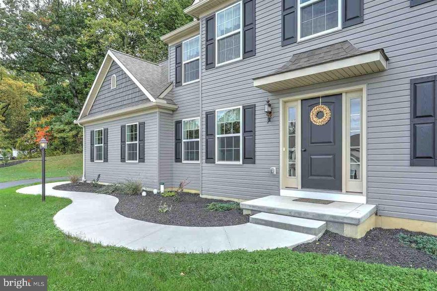 Brand New Home! Rich hardwood, custom moldings, gleaming granite & rustic fireplace set the stage for luxurious living. Custom new home features warm colors, spa master bath, sleek white kitchen & spacious rooms. Separate office & dining, huge master suite and 3 bedrooms w/ Jack & Jill bath. Walk to Rail Trail, John Rudy Park and Central High with this great location!   Large lot backing to woods, views from front of home,  NO HOA!