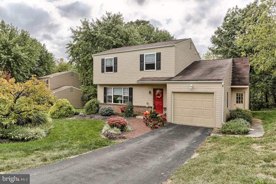Close to Hershey Medical Center, I-83, & shopping. Located on a quiet cul-de-sac with wooded backyard. Large covered deck with retractable awning. Newer white kitchen with all appliances conveying "AS IS". Sunken 1st floor family room features laminate flooring, lots of windows & skylights for open airy feeling & leads to deck. Hardwood floors in living room & dining room. New carpet in bedrooms & stairs. New siding, newer roof & windows. Extra deep garage can fit 2 cars back to back.