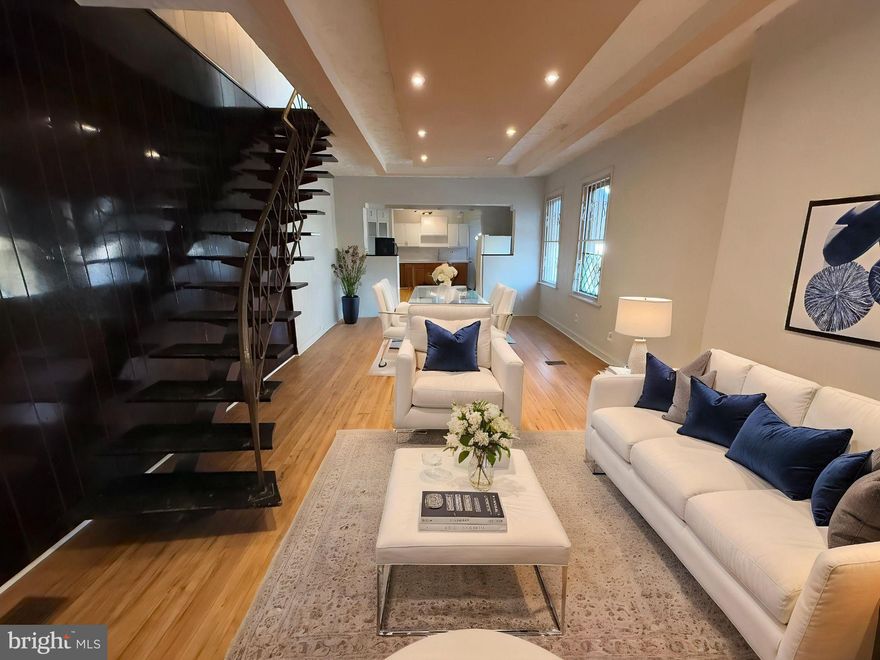 RARE OPPORTUNITY to own this unique, well-maintained CORNER Row Home with an EXTRA HUGE LOT at the rear backyard (about 1,383 sq. ft. lot size) in West Philly with many newer developments surrounding the area! Take advantage of this opportunity before it's gone! This beautiful & spacious CORNER Home features a TOTAL of 2 Bedrooms, 1 Full Bathroom, front porch, & a very large fenced in rear lot! 

This CORNER home welcomes you with a straight-through 1st floor open floor plan with nice hardwood floors throughout! This home has plenty of natural lights coming in throughout the property for energy savings! Enter onto an open front Porch to relax and enjoy the fresh air & breeze. Then you’ll enter into a very spacious Living Room with gleamy hardwood floors, unique tray ceiling with recessed lights extending all the way through to the spacious Dining Room! Next, you'll enter into the spacious Kitchen with anabundance of white cabinetry, tile backsplash, hardwood floors, and kitchen appliances (includes Refrigerator & Stove/Range). Exit the Kitchen to find a VERY BIG private fenced in rear yard that is great for warm weatherentertainment or you can park plenty of cars at the back of the property! (NOTE: There used to be another building with 2-car detached garages on this large size rear yard before it got demolished at the beginning of this year.)

2nd Floor features a spacious master's bedroom & another nice size bedroom! (NOTE: Previous owner converted 2 bedrooms into the current Masters Bedroom, so it used to be an 3 Bedroom property.) Entire 2nd Floor has beautiful luxury vinyl plank floors in every bedroom! Hallway Full Bathroom on 2nd Floor has a single vanity, toilet, bathtub with sliding glass door, tile floors & tile walls! Full Basement is very spacious, unfinished & clean! The property uses forced hot air for Gas Heating & electric hot water heater! Rents around this area are about $1,250-1,500/month! This home is very well-maintained & it's in a move-in condition! Property is being sold strictly in AS-IS, WHERE-IS Condition.  

Septa bus / trolley stops & public transportation are easily accessible in the area! Close to shopping centers/plazas, supermarkets, stores, gyms, restaurants, parks, & much more! Easy access to all major highways! Minutes away from Philadelphia's International Airport, Fairmount Park, Drexel Univ., Univ. of the Sciences, Univ. of Pennsylvania, Saint Joseph’s Univ., Center City, Philadelphia Zoo, Children’s Please Touch Museum, & many more! PRICED VERY COMPETITIVELY TO SELL!!! GREAT for First-Time Homebuyer or Investor! Get an offer in quickly before it's gone! Available mortgage financing w/ very low down payment & potential lender's grant up to $8,000!! Limited Time Offer Only!!! Ask me how! 

***INCLUDES 1 YEAR American Home Shield HOME WARRANTY