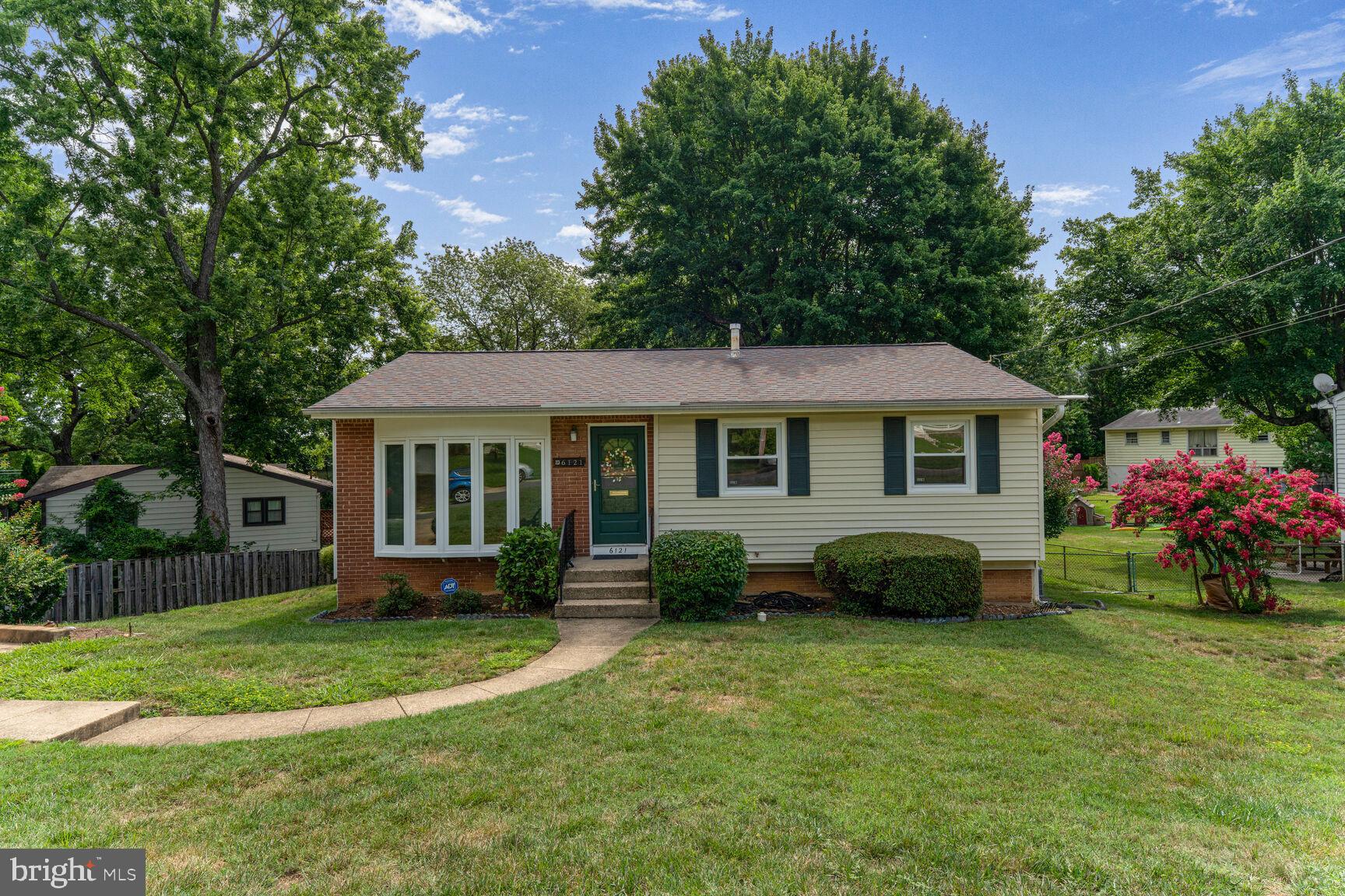 Welcome to 6121 Squire Lane, a delightful brick-front gem in the Sunny Ridge Estates subdivision. With only a few stairs at the front entry, step into a freshly painted interior that offers a warm and welcoming ambiance throughout. The main level of this charming home features an inviting living space adorned with hardwood floors and a picturesque bay window that floods the room with natural light. The kitchen opens to a dining area and a sliding glass door leading to a spacious composite deck overlooking a lush backyard—perfect for entertaining or relaxing. Rest well in any of the 3 main level bedrooms with easy access to the full bath with ceramic tile floor and modern vanity. The walk-out basement boasts a recreation room, spacious storage area, den/4th bedroom ntc, half bath and laundry room. Ceramic tile flooring adds versatility and quality. Enjoy the convenience of a concrete parking pad. Don’t miss out on calling this adorable abode your new home!