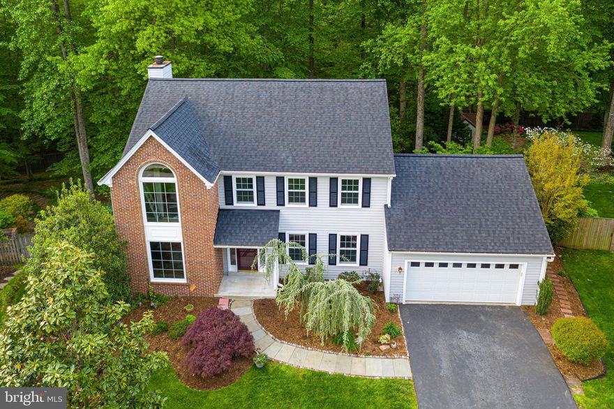 *** This STUNNING MOVE-IN READY 5 bedroom, 3.5 bath home is nestled in a beautiful cul-de-sac in the South Run Oaks neighborhood! This home backs to woods & boasts one of the most amazing woodland lots in this neighborhood with a gate opening directly out to the myriad of trails connecting to Lake Mercer & Burke Lake! This amazing home has been TOTALLY RENOVATED & has a BRAND-NEW ROOF IN 2020 along with all new carpet, fresh new gray paint, new stove, new fridge & new microwave also in 2020!! Walk through the front door & you are immediately struck with the gleaming hardwood floors & the wide OPEN-CONCEPT floor plan allowing easy sight lines from the living to the large formal dining room! The real WOW here though is when you step into the back of the house & see the large family room with 2 stunning large plate glass windows with views to your private backyard paradise below!! Not only can you enjoy the additional light brought in by the peek-a-bow window from the living room, but also the built-in cabinets & lovely wood-burning fireplace with a large mantel add class & dignity to this phenomenal room!  The kitchen boasts newer cabinetry, lovely grey counter-tops & a convenient island with a handy breakfast bar, in addition to the nearby breakfast nook area. A large pantry completes this kitchen. Step out onto your deck & enjoy  life amid nature ! In addition, this home has a WALK-OUT basement along with a lovely lower deck too! The upper level has FOUR bedrooms,  2 lovely renovated bathrooms with gorgeous plank tiles  & an extra wide hallway!  All four bedrooms also have ceiling fans & boast new carpet & fresh paint.  The master bedroom also has a small retreat section with lovely views out of the large Palladium window & available access to the 4th bedroom should you desire to use it as an office!  The walk out basement has a large open recreation room, an extra-large 5th bedroom, a gorgeous newly renovated full bathroom, a large laundry room & a huge storage room too. Great schools = Silverbrook Elem. & South County Middle & High School!  2 nearby commuter lots, 2 VRE Stations & a mere 15 min. to the metro! Easy access to Fort Belvoir, DC and the #95 too! DO NOT MISS THIS GEM OF A HOME!!