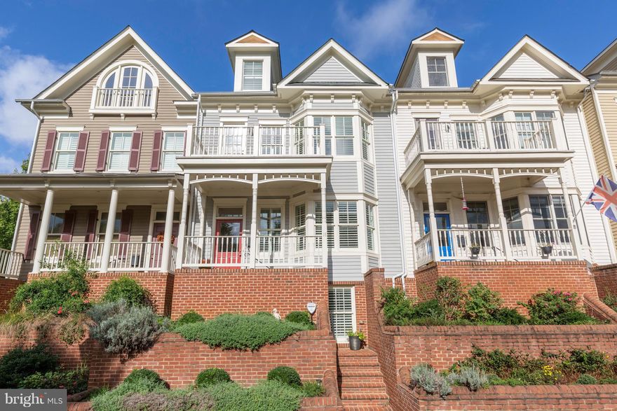 Gorgeous WV townhome in Acton's Landing featuring 4 light filled finished levels. Enhancements: NEW 5" hardwood flooring on the main level;  Architectural features including cabinetry and built-in seating in LR, and LL bedroom; Updated kitchen with granite, etc., 2 car garage, and landscaped exterior. Walk to in-town restaurants, shops. The best that Ann. has to offer. See what you are missing!