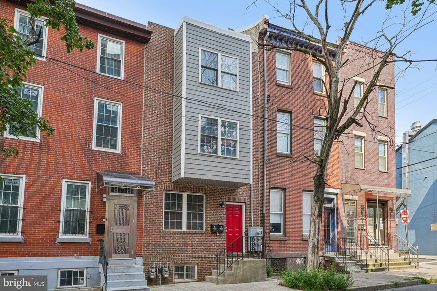 Welcome to 552 N 11th Avenue, a 3-story duplex in the Loft District offering approximately 2,800 sq. ft. plus a finished basement. Current rents are below market—each unit has the potential to rent for $2,000+ per month, creating strong upside for investors or owner-occupants. Each bi-level unit features updated kitchens with stainless steel appliances and granite countertops, in-unit washer/dryer, and central air/heat. Unit 1 is a 2-bedroom, 2-bath with access to a private patio and finished basement (currently vacant, previously rented for $1,850). Unit 2 is a 3-bedroom, 1-bath, tenant-occupied at $1,800/month through December 2025. Recent updates include new roof (2024), water heater (2024), vinyl siding (2023), windows and slider (2023), plus renovated baths and flooring (2024–2025). With separate utilities and a prime location near the Broad Street Line, restaurants, and Center City, this property is an excellent opportunity.