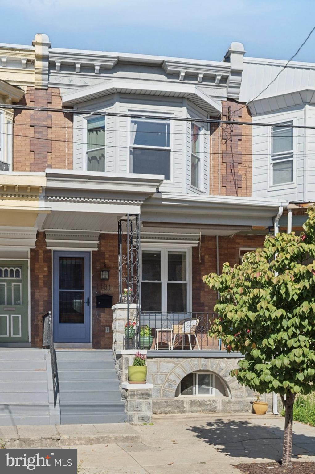 The perfect blend of original details, thoughtful updates, and West Philly charm. Located on a quiet, low traffic block, you’ll begin to fall in love with 1131 Divinity the moment you step onto its welcoming front porch. The beautiful antique front door opens onto a bright and spacious living and dining area featuring a classic brick fireplace, tasteful original staircase, ample lighting, large coat closet and convenient first floor half bath. Continue back to the spacious eat in kitchen and you’ll find plenty of cabinet and counter space, stainless appliances, and a bonus sink in the center island. The large fenced backyard offers plenty of space for outdoor dining, gardening, and relaxing while still leaving room to play. Back inside, take the original rear staircase OR the front stairs up to find three generously sized bedrooms all with ample natural light, good closet space, and ceiling fans. The hall bathroom features a deep tub with subway tile and marble tile accents and a linen closet. Back downstairs, the large and bright finished basement offers plenty of additional living space for work, play, and storage, a second full bathroom, laundry, and a separate front room perfect for a quiet home office.
Wonderful location on a quiet but friendly one way street. Just down the block from a rec center where you can join your neighbors in basketball, pickleball, tennis, roller skating, swimming, fun on the playground, or story time in the library. A short walk to Clark Park, Cedar Park, Woodlands Playground, and the wonderful shops and restaurants along Baltimore Avenue. Great public transit access - a trolley line down the street, a regional rail station around the corner, and plenty of bus lines.
Don’t miss this well-maintained West Philly gem. Schedule your visit today!