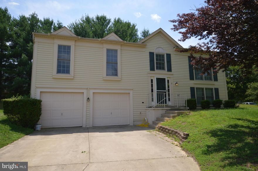 Great House Great Location! Large Split Foyer With 4 bedrooms and 3 Full Baths. New Paint and Carpet.  Updated  kitchen with Stainless Steel Appliances and Hardwood Floor. Tiles in Bathrooms. Separate Dining Room. Nice Deck. Master bed with Full Bath and Walk-in Closet. Family Room with Fireplace. 2 Car Garage with Long Driveway.  Close to Shopping and I-95.