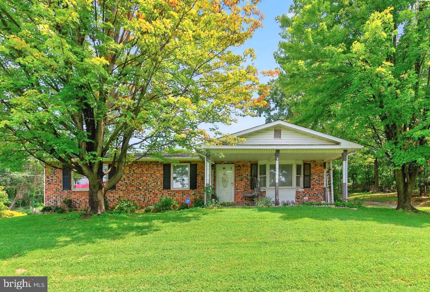 Just a mile from the Virginia line—and moments from the Appalachian Trail—this classic 1981 brick rambler offers a peaceful retreat with the perfect blend of comfort, convenience, and natural beauty. Whether you're buying your first home, downsizing, or looking for a smart investment, this property invites you to enjoy a simpler way of life.

Step inside to a cozy, well-maintained interior with laminate flooring, a kitchen/dining combo with updated oak cabinetry, and white appliances. The layout is functional and move-in ready, with opportunities for cosmetic updates to make it your own.

Downstairs, a full unfinished basement offers ample space for storage, laundry, and utilities. It provides plenty of room for practical use and future potential.

Out back, enjoy your morning coffee or evening glass of wine under the covered concrete patio, surrounded by mature oak trees that provide peaceful shade and seasonal color. The 0.55-acre lot feels both open and private, and a 12×16 shed (built in 2002) adds extra storage or workshop space.

Set in a lightly wooded neighborhood in Harpers Ferry, this home offers an easy commute to Northern Virginia and close proximity to scenic trails, rivers, and historic downtown Harper's Ferry attractions.