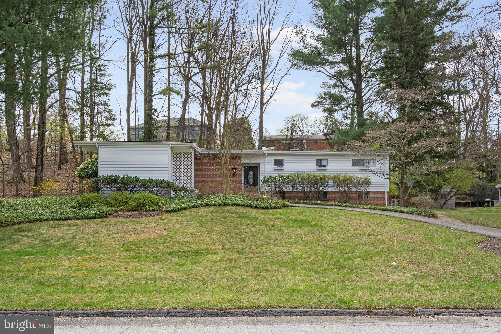 Welcome to this stunning, fully renovated split-level home with over 2,000 finished square feet in the heart of Midfield, where modern updates meet timeless charm. Step inside to an open floor plan with stylish LVP flooring throughout the main level, perfect for today’s lifestyle. The bright and airy living room features a cozy brick corner fireplace—ideal for chilly nights and comfortable gatherings. The spacious dining room boasts tall ceilings and abundant storage, creating a welcoming space to wine and dine guests. The beautifully updated kitchen is a chef’s dream, complete with quartz countertops, a custom tile backsplash, and ample cabinetry for all your cooking needs. A convenient powder room is located just off the main entrance. Enjoy peaceful mornings or unwind in the evening in the covered sunroom—perfect for sipping coffee or diving into your favorite book. Upstairs, the serene primary suite offers double closets, plenty of natural light, and a luxurious ensuite bath featuring a custom tile walk-in shower and a private sauna for ultimate relaxation. Two additional bedrooms with generous closet space and a full hall bath with a tub/shower combo complete the upper level. The fully finished lower level with a separate entrance offers even more living space with a large rec room, guest bedroom, full bath, and a kitchenette—ideal for in-laws, guests, second living space or entertaining. Step outside to your private backyard oasis, complete with a treehouse and room to host summer BBQs. Conveniently located near Old Court Road, Greenspring Avenue, I-695, and Reisterstown Road, this move-in-ready home truly has it all!