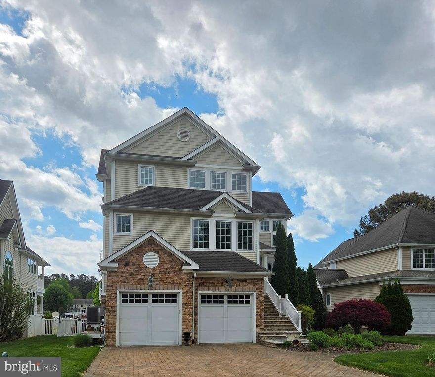 Escape the ordinary in this one-of-a-kind waterfront masterpiece on Cox Creek. Designed for those who refuse to settle for "cookie-cutter," this residence seamlessly blends sophisticated daily living with an unparalleled entertaining layout.

The ground-level "Party Zone" is a showstopper, featuring a full bar and lounge with dual garage doors that open directly to a private oasis complete with a pool, hot tub, and patio. Just steps away, your private dock awaits, equipped with two boat lifts, water, and electric. Inside, the craftsmanship shines through extensive custom built-ins and exquisite trim work.

The heart of the home is the chef’s kitchen, recently remodeled with stunning Taj Mahal Quartzite, marble backsplash, and a hidden wine cellar. The top-floor primary retreat is a destination of its own, boasting a private viewing deck, a spa-like bath with a rain shower/jetted tub, a massive custom closet, and a dedicated morning bar (fridge/microwave/laundry) for ultimate convenience. With two additional ensuite guest suites and a flexible loft space, this home offers luxury at every turn. Live the life you’ve imagined—schedule your private tour today.