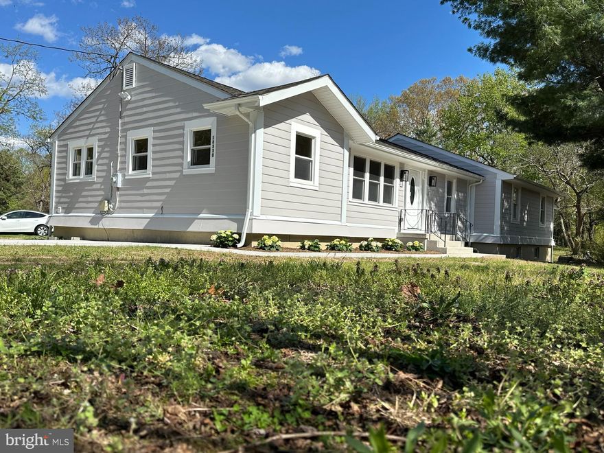 Beautifully renovated house for you to enjoy. Spacious open design with 3 bedrooms on main floor and more rooms in the fully finished lower level. New roof less than 5 years; very new quality siding. Gaumont kitchen with island. This purchase includes 2 lots: The lot with the improvement is 1.07 acre (tax ID#040255059), and the raw land is 1.40(Tax ID# 040259705). NO HOA! This is country living at its finest, while still having major commute routes 301, Branch Ave, 4 and DC close by. This spacious property is to be enjoyed in and out. Octagon deck around a tree for happy party gathering. There are endless possibilities with these 2 lots! There is a private well and septic. The roof is less than 5 years old. No perc tests have been performed on the unimproved lot. Has forced heat and brand-new AC condenser. Must see!