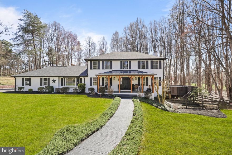 Stunning all brick colonial that looks like it's straight from the pages of Architectural Digest. 
Professionally decorated – and updated throughout – you will love the privacy of the 5-acre flat lot and its proximity to everything – including the charming town of Clifton.
A beautiful covered entryway greets you as you walk into this amazing 5 bed, 3.5 bath home.
New roof in 2025, including the accent metal roof with oversized gutters and gutter guards. Fully renovated kitchen in 2025 with quartz countertops, seated bar area, white soft-close cabinetry, beveled mirror tile backsplash and all new LG appliances. The primary bath was updated in 2023 and has a double shower with a separate sauna and quartz countertops. The entire interior of the home was just repainted this year and all new LVP flooring was installed on the main and lower levels in 2024. Hardwood floors on the upper level. 
The home features three fireplaces — including one in the primary bedroom, a family room with a wood-ceiling accent, a three- level extension on the back of the home, with a wall of windows on the main level, multiple decks, including one off the primary suite – that is completely private and has a TV for your viewing pleasure and a fire pit! The main-level office has built in bookshelves with a large picture window. All updated lighting throughout the home is from Arhaus and Restoration Hardware. New LG Washer and dryer in 2025. The expansive walk-out basement has a full bedroom, fully updated bath, large recreation room, an exercise room and plenty of storage. New water treatment system installed in 2024.
Get ready to fall in love with the extra-large patio and pavilion that was added in 2023. A great place to do all your outdoor living. A walkway from the home to the patio was just installed in March of 2025. Two-tiered rear deck with a 6 seat Jacuzzi hot tub, professionally serviced and maintained.  A new, oversized storage shed was added in 2024, the entire exterior of the home was painted in 2023. The yard.. has plenty of space to add a pool or play a full game of soccer or football. A great fire pit, a long-private driveway, mature trees adding privacy and so much more.  Perimeter fence plus a smaller fenced area for your pets.  
Over 400k in upgrades have been recently made to this exquisite and inviting home.   
Both the well and septic were inspected in 2024 with the septic being pumped at that time as well. 
Home is close to all the major commuting routes and plenty of shopping and restaurants are nearby. The popular town of Clifton is just a short distance away.
Country living at its best all while being close to it all. An absolute stunner!!