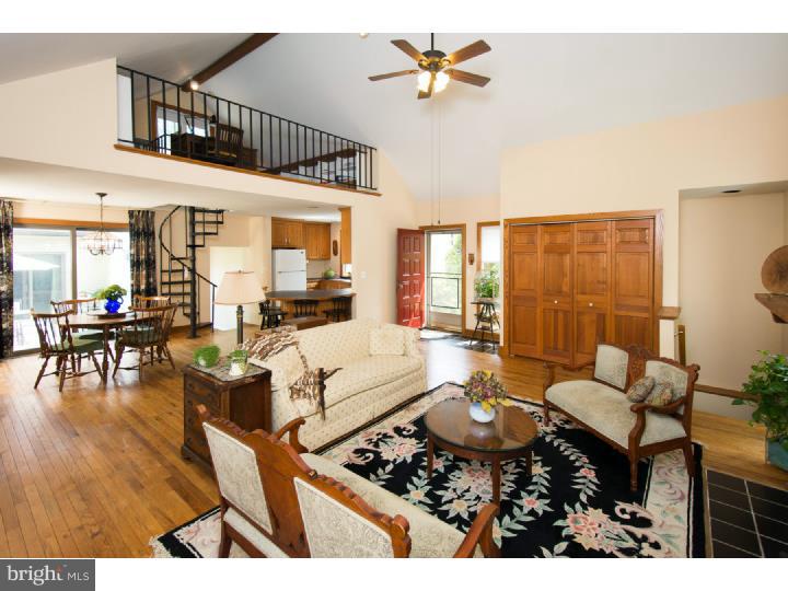 Unique 4 Bedroom 3 Bath Contemporary Home with Modern Flaire! This is NOT your cookie-cutter floor-plan. One floor living with a Bonus Loft/Office and a Private 4th Bedroom Suite with Full Bath. Enter into a Great Room with Cathedral Ceiling and Hardwood Flooring - Featuring a Floor to Ceiling Fireplace - Opened to the Dining room with a Sliding Door leading to the Private Deck which is nestled between the Master Suite and the Main Living Area. The Kitchen boasts a new Stainless Steel Range, 42" Oak Cabinets and a Breakfast Bar. The Master Suite with parquet tile flooring & Full Bath has sliding door access to the deck - Providing a breezeway affect for those comfortable summer nights. 2 Additional bedrooms & Another Full Bath and Laundry room complete the main floor living. A Private Guest Room with En-Suite Bath is on the upper level with Vaulted Ceiling and Exposed Natural Wood Beams. The Finished Basement makes for a great family room with storage and walkout/egress. Brand new vinyl Siding, and Freshly painted Exterior. Mature Plantings abound on this 1/4 acre yard. Convenient walk to Marple-Newtown High School and Worrall Elementary School.