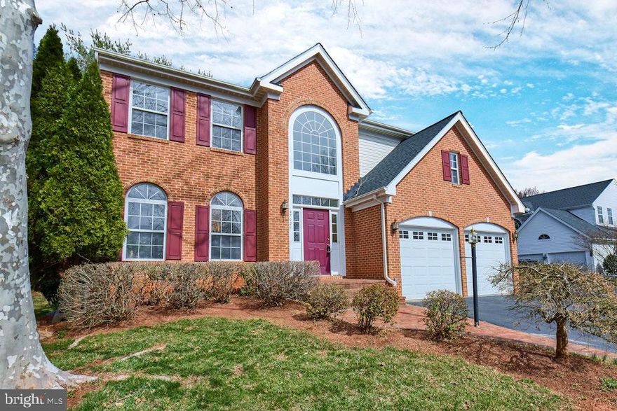 GORGEOUS BRICK-FRONT SINGLE FAMILY HOME ON CUL-DE-SAC, with over 2,300 finished square feet! Spacious 3-level home offers 4 BR, 2.5 BAs, 2-car garage - and located in sought after Potomac Lakes!  It's all been done here - model perfect and loads of improvements and updates. ACTIVE DATE 3/20 with OPEN HOUSES on Sat (3/22) and Sun (3/23), 2-4pm. Spacious main level with gleaming hardwoods throughout is built for entertaining! Welcoming light-filled foyer leads to separate living room and dining rooms. Huge kitchen overlooks the family room, with lovely floor-to-ceiling stone hearth fireplace. Kitchen has been fully remodeled to perfection, with gleaming quartz counters, ample shaker style cabinetry for all of your kitchen and storage needs, top-of-the-line Bosch and Wolf stainless steel appliances, separate eat-in island, and a gorgeous light-filled sunroom. Sunroom leads to custom brick patio - a perfect oasis for morning coffee or dining al fresco.  Backs to mature trees and evergreens for year-round privacy and tranquility. Back staircase from kitchen joins main stairwell that leads to upper level, featuring large primary suite with luxurious  remodeled bathroom! Bath includes double sink vanity, soaking bathtub, separate shower, separate commode, and walk-in closet.  Three spacious bedrooms located on upper level offer loads of light and ample closet space.  Second updated full bath with custom frameless shower doors also on upper level - and bonus - washer/dryer located on bedroom level! Expansive lower level offers loads  of unfinished space either for storage or hobby areas - or for expansion of living space, extra bedroom/ extra bathroom, office, playroom, etc!  Lower level also features French doors that open to extra wide walk-up stairs leading to custom patio.  Customize the space to fit your current and future needs!  Multiple upgrades over the past 3 years including new roof, hot water heater, HVAC, sump pump, and paint.  Hardwoods installed 4 years ago, and the entire kitchen was remodeled 7 years ago with the finest fixtures and finishes!  Located in Potomac Lakes, this lovely community offers multiple pools, tot lots, tennis courts, trails, and so much more. Shopping is abundant with a multitude of grocery stores, retailers, restaurants, and more located within minutes. Fabulous award-winning Potomac Falls high school pyramid! And commuting is a breeze with multiple auto, rail, and flight options via Dulles within minutes. This home offers the perfect combination of location, community amenities, and upgraded, elegant living! Professional photos to be uploaded next week.  MOVE FAST!