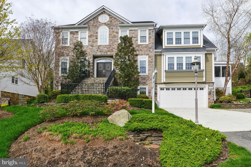 STATELY 6 BR + 5 1/2BA STONE COLONIAL OFFERING 6,800 SQ. FT. OF LUXURY LIVING. SPACIOUS ROOMS, HIGH CEILINGS, FINE MOLDINGS, 2 FPS, FABULOUS CHEF'S KITCHEN & DELIGHTFUL SCREENED PORCH. FULLY FINISHED LOWER LEVEL WITH NANNY SUITE, EXERCISE ROOM, HUGE REC ROOM + 2 CAR GARAGE. THIS IS A GEM!