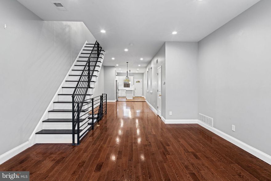 Step into 1926 Moore St, a spacious and modern haven in the heart of Philly! This beautifully updated townhouse is designed for comfortable stylish living with an abundance of natural light. Throughout the home, handsome hardwood floors and recessed lighting create a warm, contemporary vibe. The kitchen is a true centerpiece, boasting premium countertops, stainless steel appliances, and a large versatile island, perfect for everything from casual meals to hosting gatherings. A convenient half bath is also on this floor. Upstairs features 3 generously sized bedrooms and 2 full bathrooms, and offers ample room to spread out and unwind. The primary bedroom is a true retreat, complete with ensuite bath that includes a tiled separate shower. A cozy backyard that is perfect for savoring drinks under the stars or firing up the grill for a casual feast. Additional features include a fully finished basement for additional living space, and all of your storage needs. Move-in ready and packed with modern comforts, 1926 Moore St is waiting to welcome its next owner. Don’t miss your chance to make it yours—schedule your tour today!