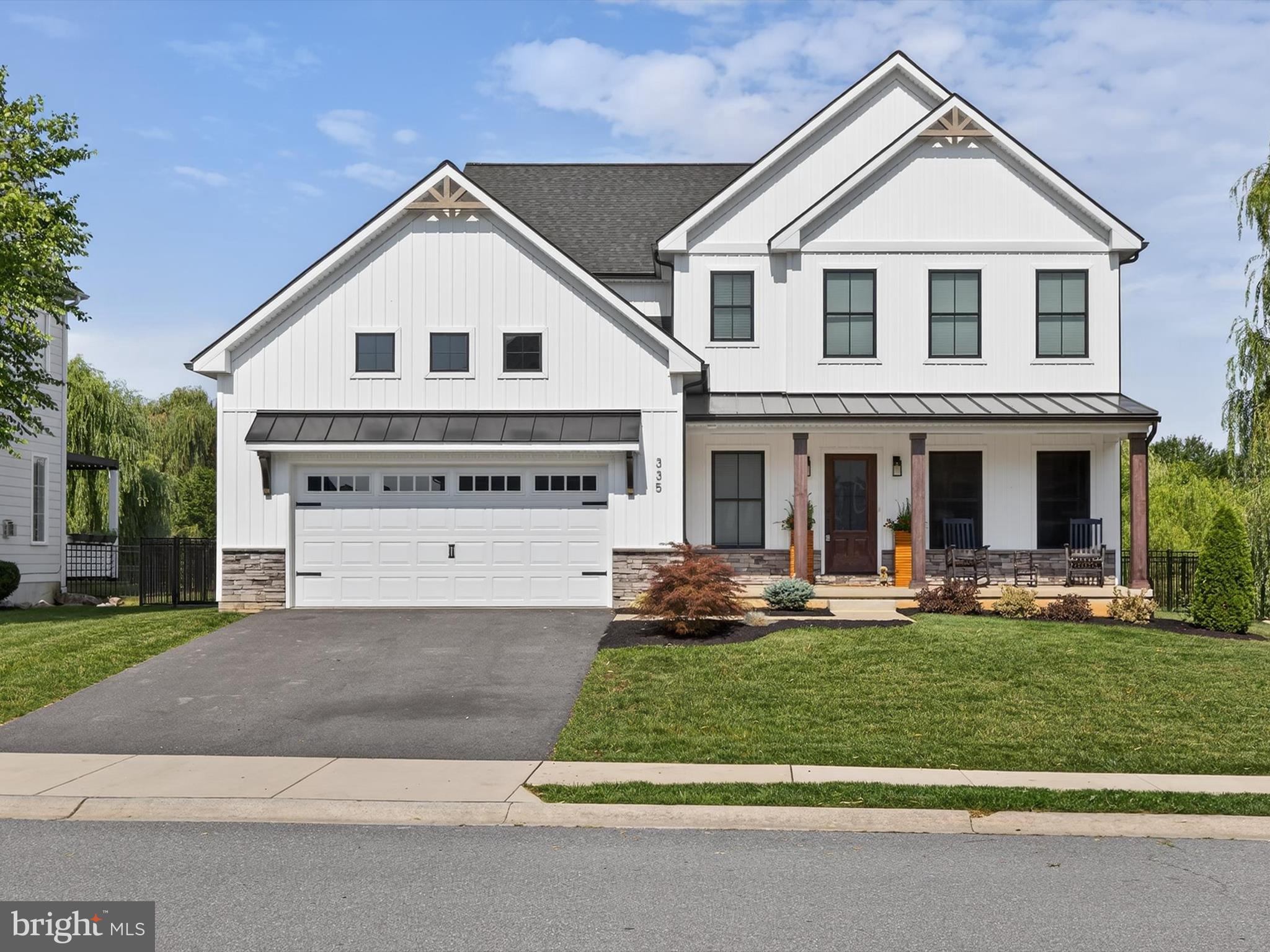 Impeccably designed farmhouse-style home located in the highly desired Millpond/ Penns Crossing community. Just minutes from shopping, restaurants, entertainment, and major conveniences. This like new 2023 spacious home features an open-concept main level with detailed crown molding, stained wood ceiling beams, and a gas fireplace. The designer kitchen boasts quartz countertops, custom cabinetry, top-of-the-line appliances, an oversized island, and a walk-in pantry. A wet bar adds functionality and style, ideal for entertaining. Main floor also includes a private office/flex room. Upstairs offers four generously sized bedrooms, including a luxurious primary suite with a walk-in closet and a spa-like en-suite bathroom featuring a custom tile shower and double vanity. A full hall bath and laundry room complete the second floor. The basement includes 9? foundation walls and energy-efficient natural gas mechanicals. Outdoor living features a covered patio with a stained wood ceiling, built-in outdoor kitchen, grill, and smoker. Fully fenced and private backyard. Stunning curb appeal with a full front porch perfect for enjoying this gorgeous Manheim Twp community. Short commute to the airport, medical facilities, and Manheim Township Park. Loaded with upgrades and modern farmhouse charm throughout. Schedule your showing today!