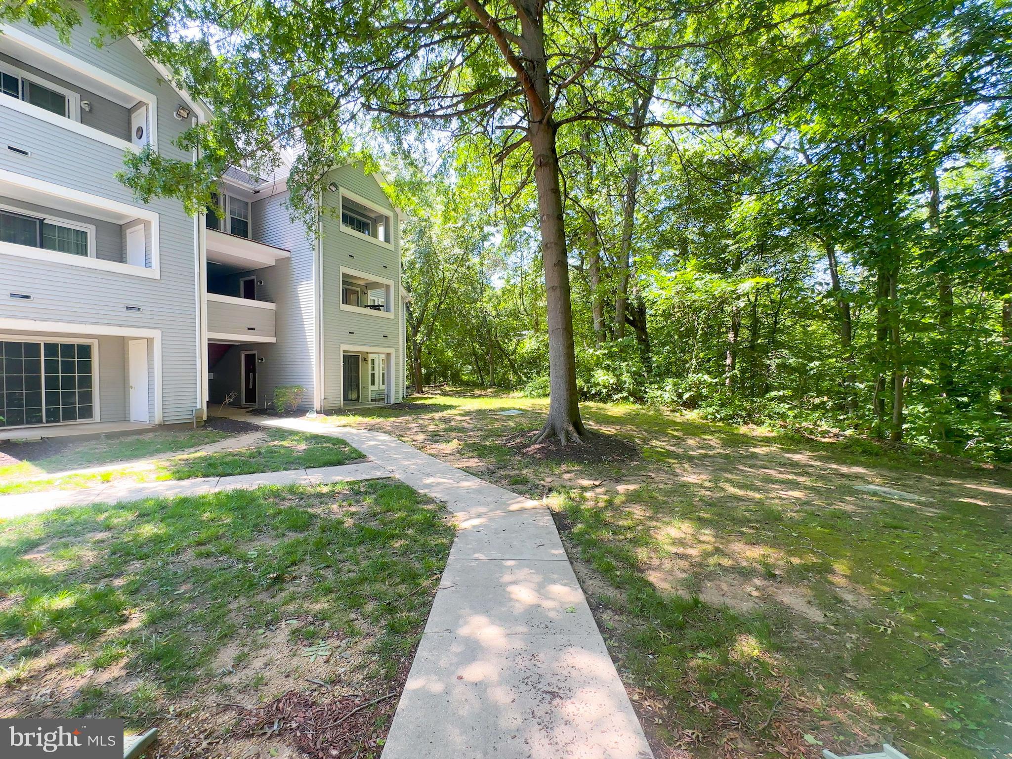 Welcome to 13350 Lord Sterling Place Unit 9-2 a beautifully maintained garden-style condo located in the heart of Upper Marlboro! This bright and spacious 2-bedroom, 1-bath home offers an inviting open-concept layout with gleaming hardwood floors and abundant natural light throughout. The kitchen features ample cabinet space, modern appliances, and a convenient breakfast bar overlooking the dining and living areas good for entertaining or relaxing at home. The bathroom is updated with a sleek vanity and full-size tub/shower combo. Both bedrooms offer generous space and closet storage. Enjoy the peaceful community setting with mature trees, private patio access, and plenty of open parking. Located just minutes from major commuter routes, shopping, dining, and Andrews Air Force Base. Ideal for first-time buyers or those looking to downsize without compromising on comfort. Don't miss this opportunity. Schedule your tour today!