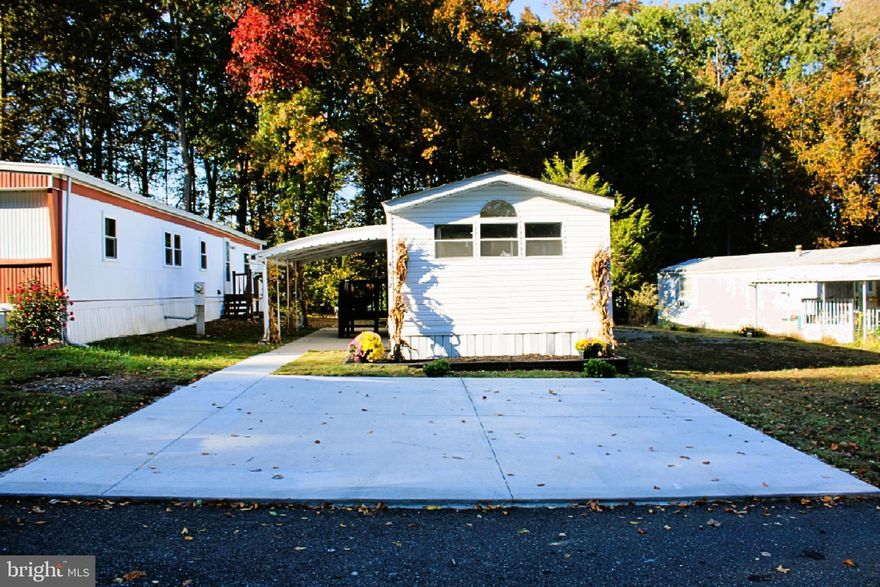 Beautifully Updated Mobile Home – This 2-bedroom, 2-full bath home showcases modern finishes throughout, including updated light fixtures. The stylish kitchen is equipped with brand-new stainless-steel appliances and quartz counter tops. A brand-new washer and dryer are also included for your convenience. The spacious primary suite features a walk-in shower and double vanity sinks.   A new roof and newer HVAC system provide peace of mind, while a backyard shed offers additional storage.
Ground rent is $805.00 per month and covers trash, water, sewage, and snow removal. Buyer to confirm square footage.