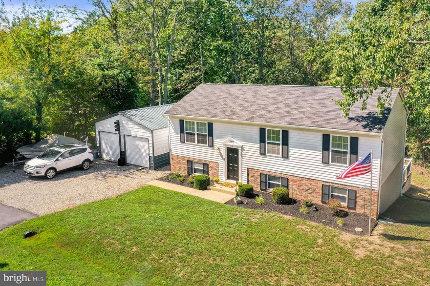 Welcome to the White Sands Community.  Updated Split Foyer on .39 Acre Lot With 2 Car Garage..  Plenty of space in this Large Private Yard to Entertain with Ample Parking in the Back.  Walking in o this Well Loved Home You Walk up a Few Steps to the Living Room with Cathedral Ceilings and Separate Dining Room.  Hardwood Floors Adorn the Living Room, Dining Room and Hallway.  There are 3 Bedrooms on this level with the Primary Bedroom having an En Suite Bathroom. The Spacious Light Filled Lower Level has Beautiful Ceramic Tiled Floors With Sliding Glass Doors that Walks Out to Your Private Deck.  There is another Bedroom and Half Bath on the Lower Level.  For the Car/Bike Enthusiast -- Must See the Custom 2-Car Garage with Cathedral Ceilings,.  This Fabulous Custom Built Garage was Well Built to Hold Two Cars.  The Perfect Man Cave!!  Please Come Preview this Lovely Home !!