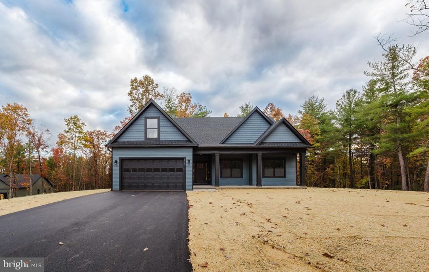 This Rancher boasts a unique floor plan in the beautiful Community of Windfall Acres on your own spacious 2+ acre lot. This is one of the premier lots in the subdivision. This home features a front porch and rear deck to enjoy all of the wonderful scenery. This home features 3 BR, 3 BA, Master BR with walk-in closet and private bathroom, kitchen features an island, and stainless steel appliances, living room with cathedral ceilings, huge, & 2-car garage with opener.