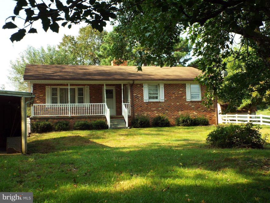 Lovely country setting.  Nice brick rambler, surrounded by green fields and trees.  Home is two living quarters.Upstairs is 3 BR's, one bath, nice kitchen. Basement is completely finished with walk-out entrance, 1 Bedroom,Bath, & kitchen.Garage, work shop & other storage buildings.  A great rental for large family or maturing teens. Oil heat & wood stoves. Decor. allowance. Call agt.