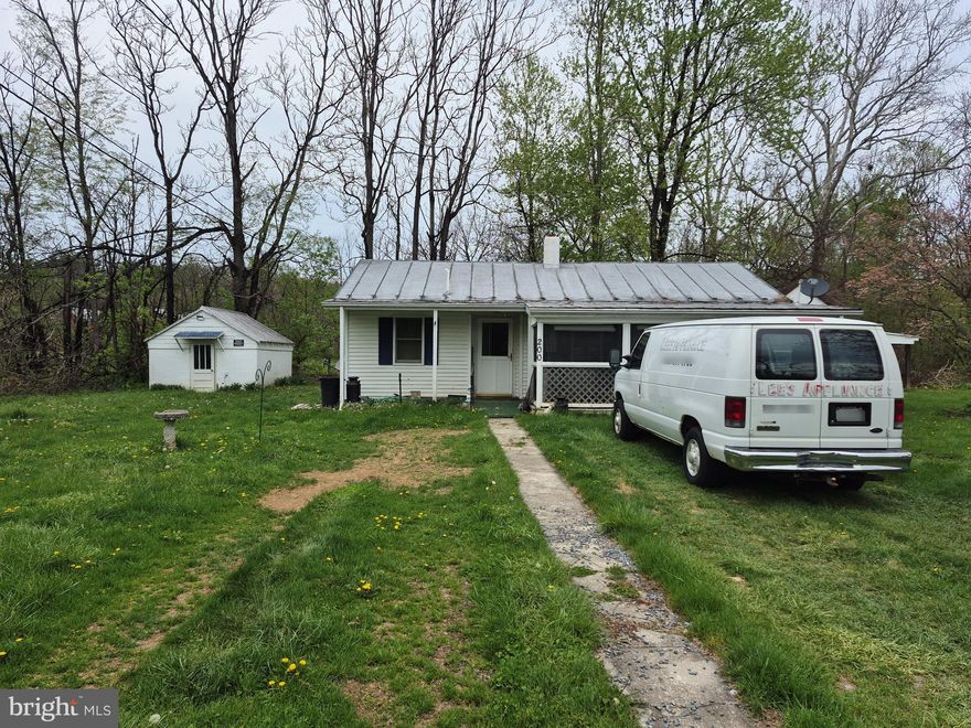 Tucked away on a quiet lane in the Gore countryside, this cozy 2-bedroom, 1-bath cottage offers an affordable entry point into homeownership or a smart addition to any investment portfolio. Built in 1964 and full of classic character, the home features hardwood floors, a metal roof, and a covered porch that invites you to slow down and take in the peaceful surroundings.
The 0.37-acre lot offers generous outdoor space perfect for gardening, entertaining, or simply enjoying the rural setting, plus outbuildings and storage that add real utility for the hobby farmer, handyman, or weekend warrior. The gently rolling topography and paved road frontage make this one of the more accessible rural properties in the area.
At 989 square feet above grade, the layout is efficient and easy to maintain, with electric baseboard heat and a concrete block foundation. Whether you're looking for a weekend retreat, a buy-and-hold rental, or a manageable project to make your own, 200 Middle Ln checks a lot of boxes at a price point that's increasingly hard to find in Frederick County.
Convenient to Winchester, Northwestern Pike corridor, and commuter routes, without the subdivision feel.