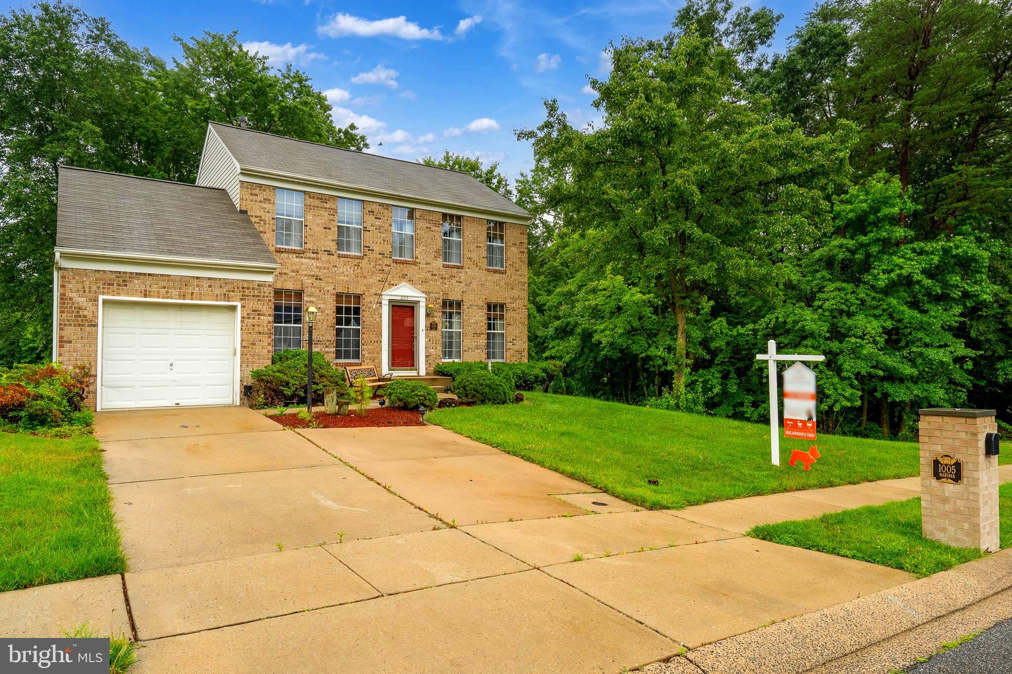 Presenting your next home - a stately brick-front home offering 3 bedrooms, 2.5 baths, and a 1 car garage with a private driveway that fits two additional vehicles. Come inside to a beautiful kitchen featuring rich cherry wood floors, stainless steel appliances, and easy access to the rear deck, which is perfect for outdoor dining and entertaining. The spacious primary suite boasts a vaulted ceiling, and private en suite bathroom with a newly installed walk-in shower. Enjoy extra living space in the finished basement, complete with a generous storage area. Roof was installed in 2020 and the water heater was installed in 2022. The large, fully fenced backyard has a parklike setting, and offers room to play, garden, or relax. Just minutes from Mariner Park, where you can enjoy trails, playgrounds, sports fields, and access to boating and other waterfront activities. This home truly has it all!