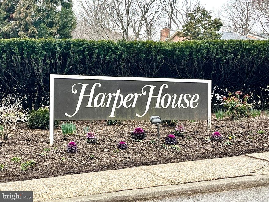 Your next home could be this enormous sun-filled condominium in sought after Harper House. This is one of the largest units in the building. Enjoy the southern and western exposures for maximum sunlight and nighttime cityscape views! As you enter the unit, you will be welcomed in through a gracious hallway with custom built ins. The hall opens into the expansive living room with a dining room alcove. The updated kitchen has space for a small table and endless cabinets for storage. You will also appreciate the back door entry from the kitchen for grocery delivery and trash removal. Parquet floors are throughout. The living room and one bedroom (or office) both open through sliding doors onto the L-shaped balcony. A hall bath (with adjacent laundry) is convenient for guests. The primary bedroom is flooded with light and boasts both a huge walk-in closet and another large closet. You will love the carefree condo living at Harper House where all basic utilities and two deeded garage spaces are included in the monthly fee.  Residents appreciate the 24-hour front desk coverage, the door attendant who can assist with packages, and access to pools and tennis/pickle ball courts. Steps away is the newly rejuvenated Cross Keys Village where you can enjoy many new restaurants and shops.