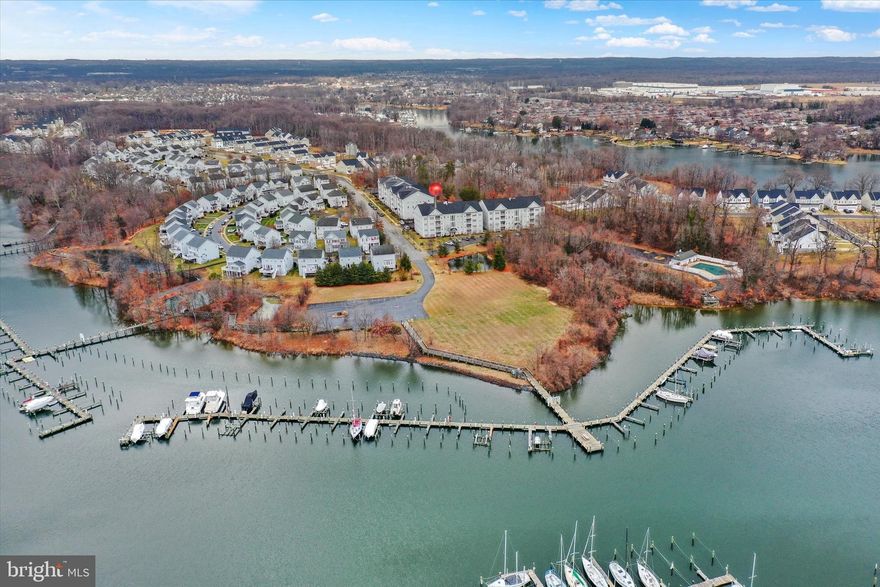 Set within the water-privileged Hopkins Landing community, this spacious 2-bedroom, 2-bath condo offers 1,544 square feet of effortless living paired with an assigned boat slip that conveys—giving you direct access to the Middle River and Chesapeake Bay without the premium of direct waterfront pricing.

Inside, the home is bright, open, and move-in ready, featuring an inviting floor plan designed for both everyday comfort and entertaining. Crown molding, custom blinds, generous room sizes, and abundant natural light create a warm, polished feel throughout. The living room is anchored by a gas fireplace, flowing seamlessly into the breakfast area, kitchen, and adjacent dining space—ideal for hosting or relaxed nights at home.

The primary suite offers privacy and comfort with a custom walk-in closet and en-suite bath, while the second bedroom and full bath provide flexibility for guests, a home office, or den. Step onto the private balcony to enjoy morning coffee or unwind after a day on the water.

Perfectly positioned within the community, this second-floor unit offers easy elevator and stair access and is just a short walk to the pool, piers, walking paths, and your assigned boat slip. Leave the trailer behind—walk to your slip and be on the water in minutes.

Hopkins Landing is a water-oriented community featuring over a mile of lighted walking paths with observation platforms, a seasonal pool, two community piers, and nearby marinas. All of this, just minutes from waterfront dining, shopping, and major commuter routes including I-695 and I-95, with convenient access to Downtown Baltimore, Towson, and Timonium.

A rare opportunity to enjoy low-maintenance coastal living with a boat slip, community amenities, and unbeatable access—without the cost of direct waterfront ownership.

Buyer to independently verify all listing information.