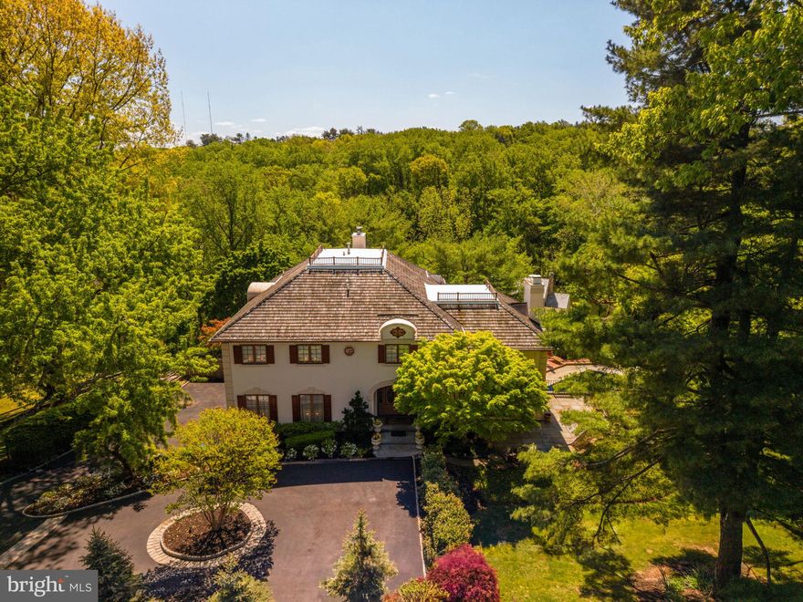 A lighthearted warmth invites you into 1533 Briar Hill, where the quintessential Main Line lifestyle awaits. Meticulous grounds and a sparkling exterior capture you from the driveway. Inside this luxurious estate unfolds across three levels built to suit large gatherings and intimate family living in the heart of the Main Line. 

A dramatic entry hall with a vaulted ceiling and curved staircase immediately reveals the refined presence and impressive scale of this classic home. Soaring ceilings continue throughout formal and informal spaces, all of which flow seamlessly and create an airy feel. The recent sunroom addition was built by the original architect to bring abundant light and a year-round connection to the serene landscape. A substantial family room accompanies the eat-in kitchen and connects to a deck with sweeping views of Gladwyne.

The finished lower level spans a game and recreation room that opens to the resort-style jacuzzi and pool. A private guest suite and 4-car garage are replete with comfort and utility. Upstairs is highlighted by an enormous primary suite and 4 additional bedrooms with beautifully updated bathrooms. Seller's rigorous maintenance schedule extends to various updates and improvements. This is a rare opportunity to own a distinguished, turn-key residence in one of the most beautiful locations in Pennsylvania. 

Contact Garrett Snider/The Lavinia Smerconish Team at Compass.