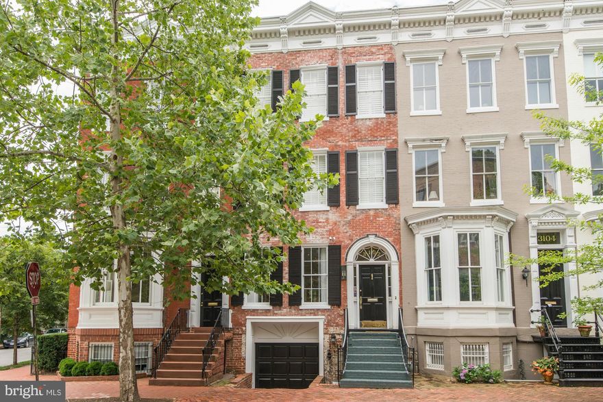 Stunning Federal in the heart of Georgetown! 4BR, 2.5 baths w/ attached GARAGE, large rear patio and roof deck! Tastefully renovated with high-end finishes, this home showcases high ceilings, original details, generous rooms with large windows flooding every space with natural light. Lower Level has separate entrances, access to garage, family room and lots of storage.