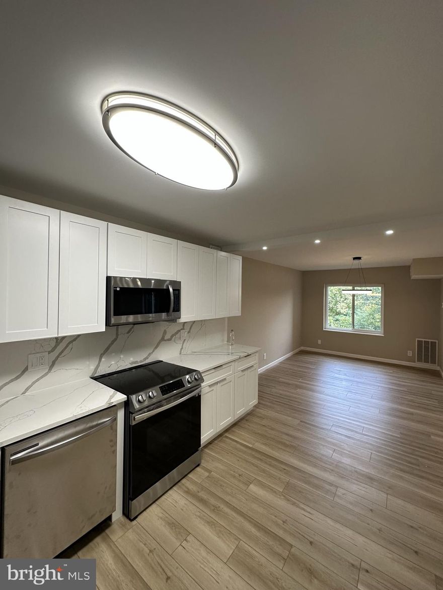 EE-unit in The Rotonda completely renovated with high end materials. Unique open kitchen concept and beautifully designed and remodeled bathrooms. Walk-in closets in both rooms.  Gated community in the heart of Tyson's Corner. Walking access to multiple Metro Stations, luxury shopping at Tyson's Galleria and Tyson's Corner Mall. Across from the Boro complex that offers a Whole Foods, movie theater, and multiple restaurants. Plenty of open parking space, walkable trails around the private gardens and lake. Access to recently remodeled pools and gym. Access to electric vehicle parking, car wash and vacuum, soccer field and tennis courts.